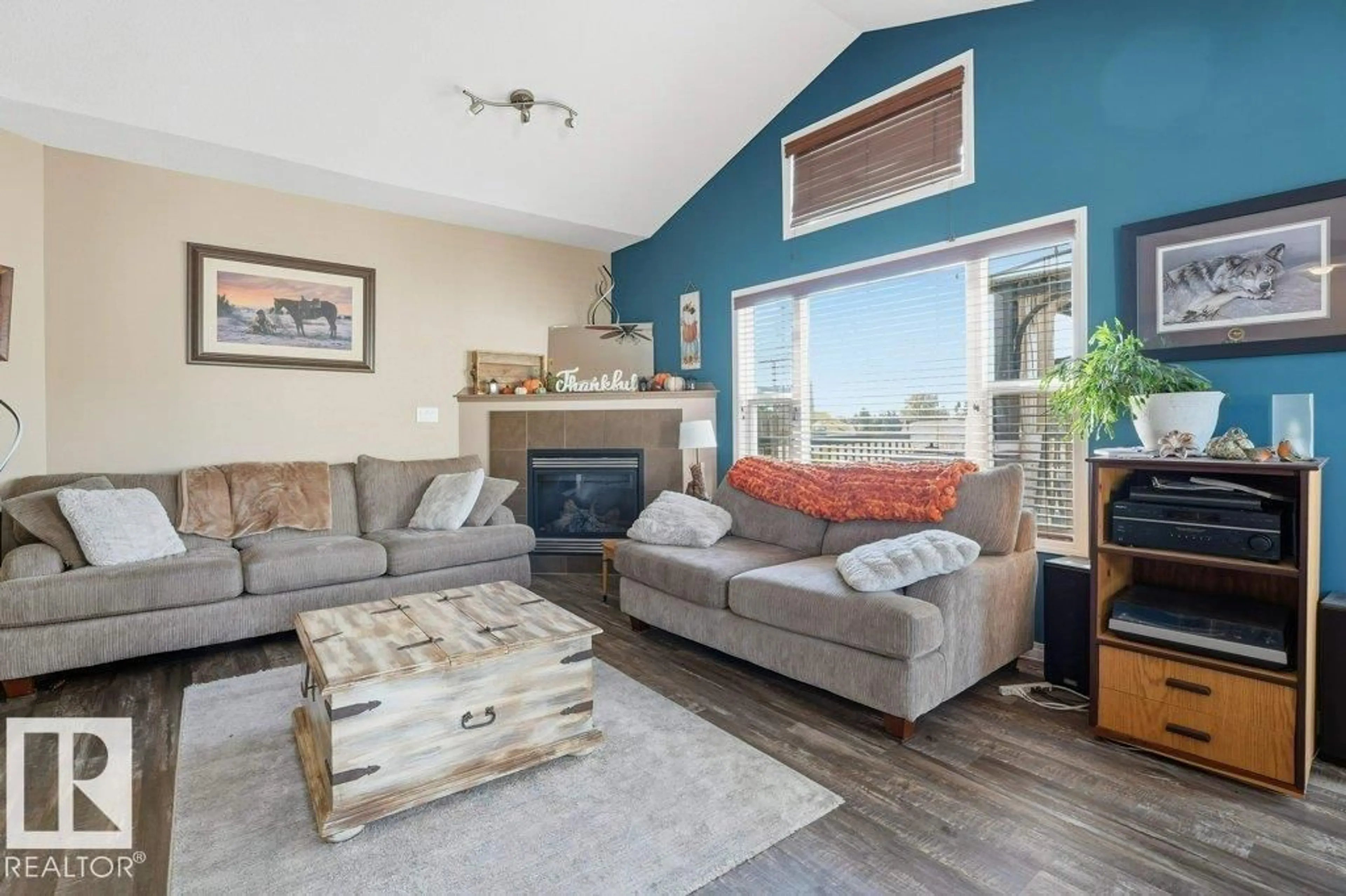 Living room with furniture, wood/laminate floor for 81 GRAYRIDGE CR, Stony Plain Alberta T7Z0A1