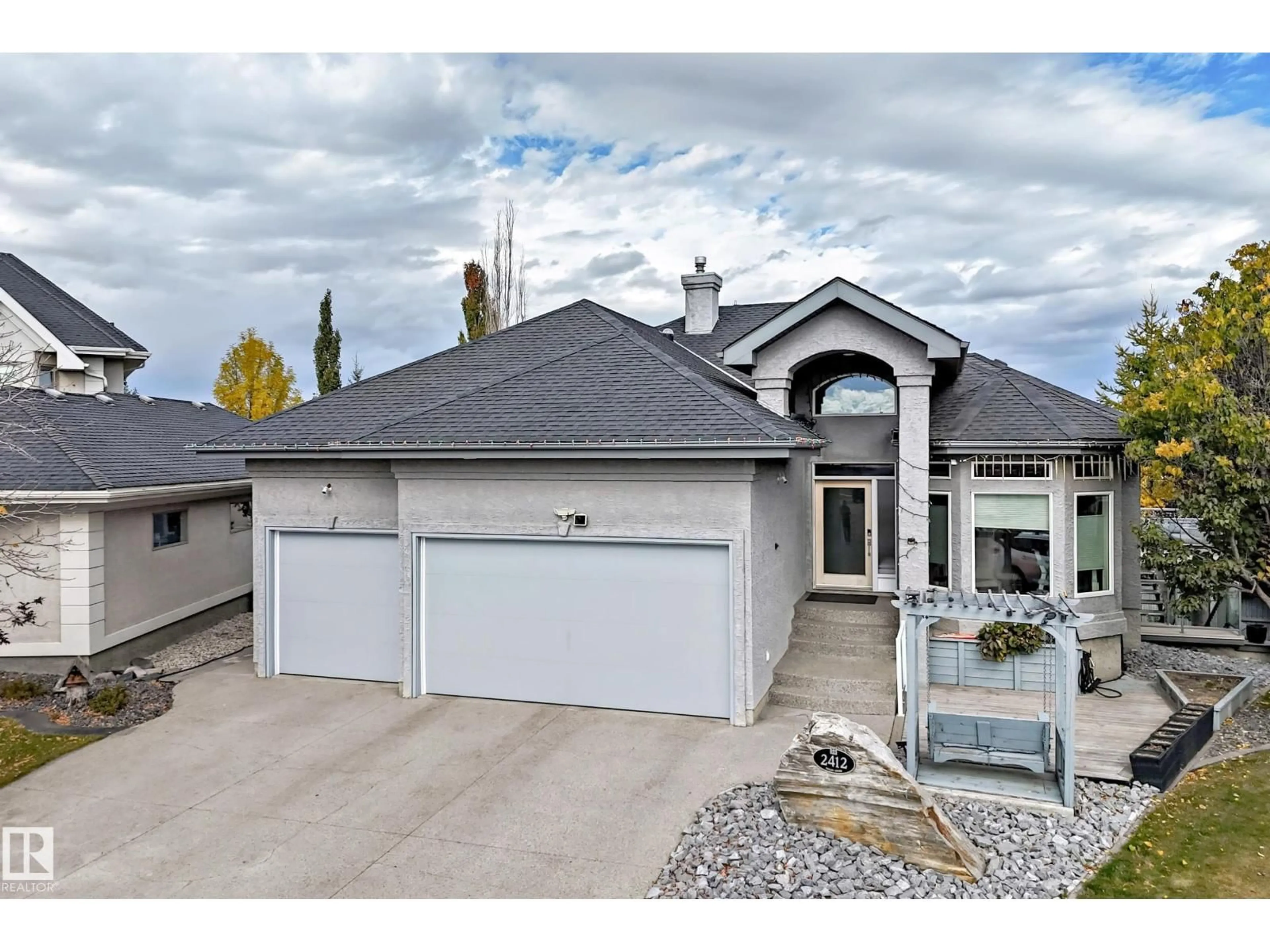 Home with vinyl exterior material, street for NW - 2412 TEGLER GREEN, Edmonton Alberta T6R3K2