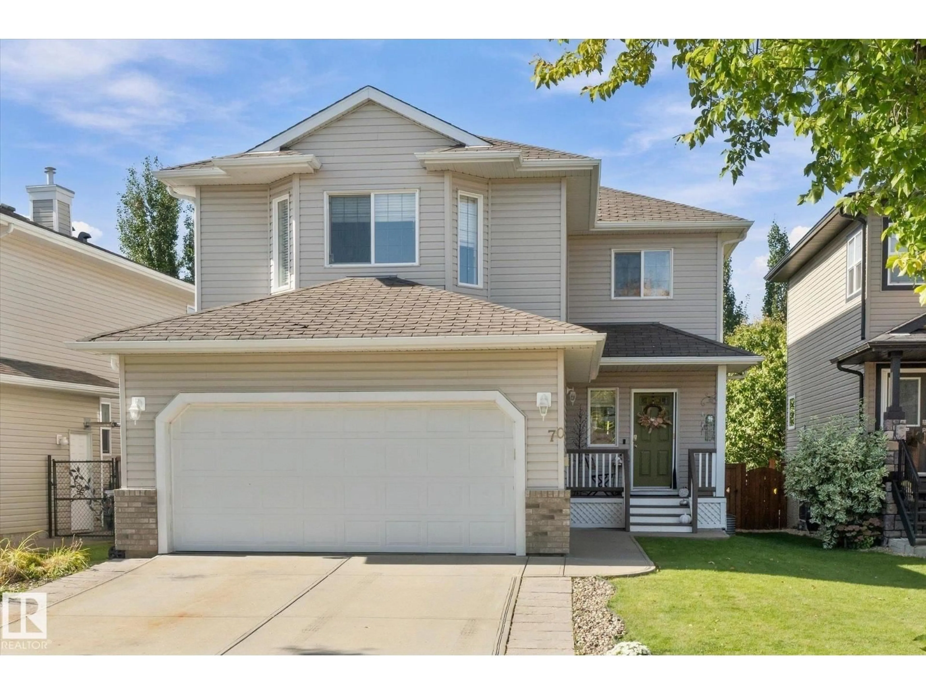 Home with vinyl exterior material, street for 70 GREENFIELD WY, Fort Saskatchewan Alberta T8L0A1