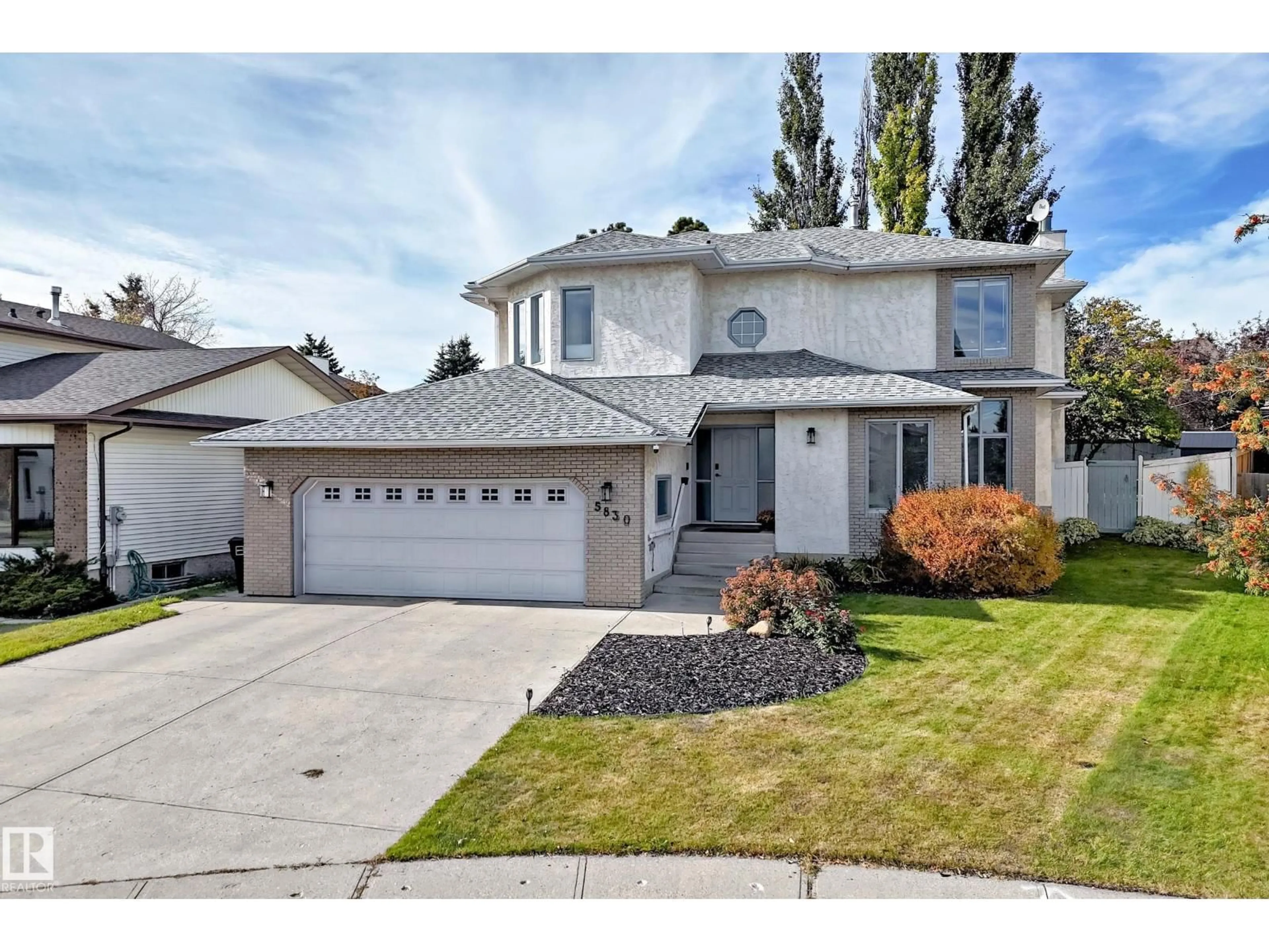 Home with vinyl exterior material, street for 5830 181 ST, Edmonton Alberta T6M1V6