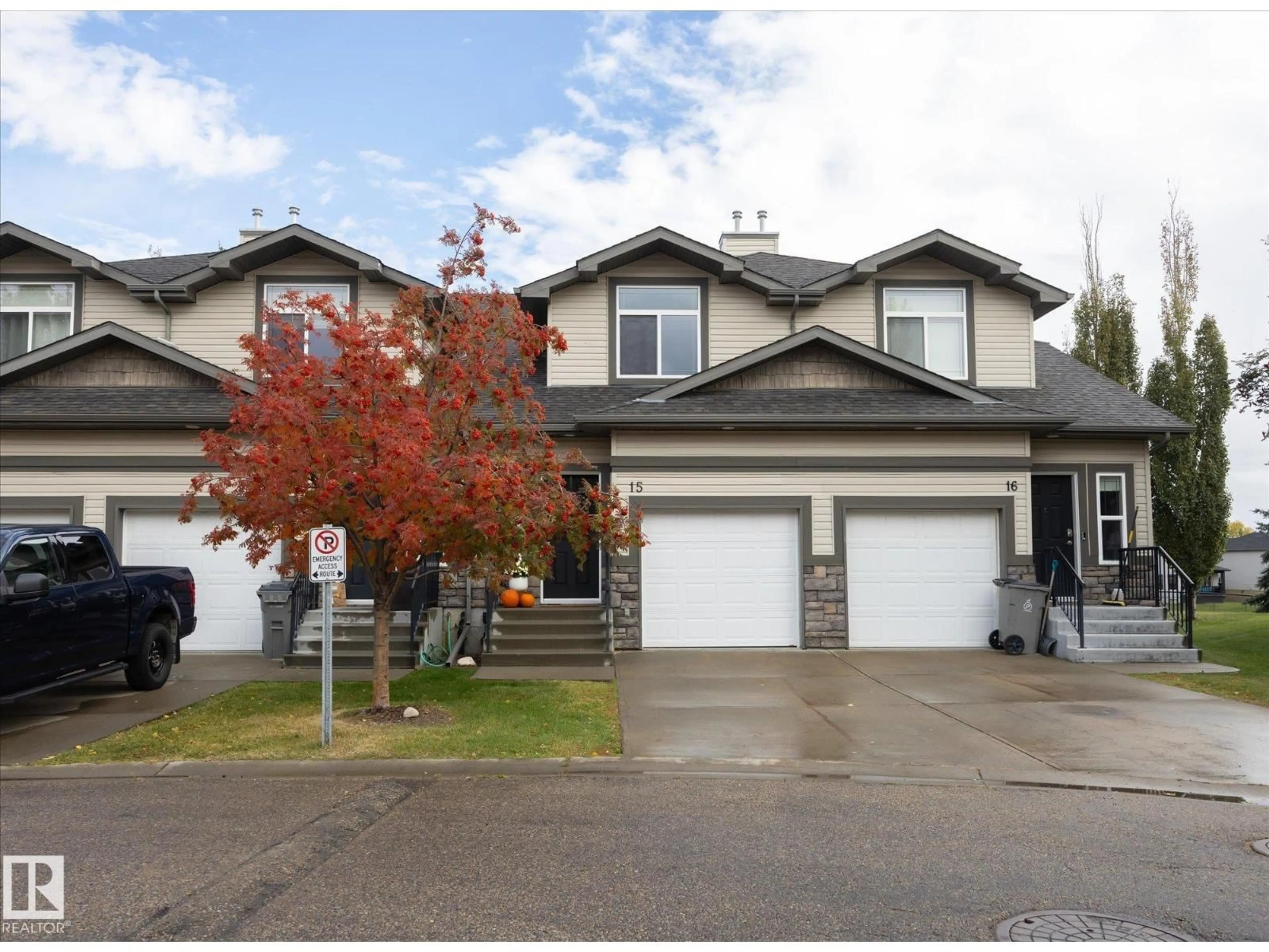 Home with vinyl exterior material, street for 15 - 9511 102 AV, Morinville Alberta T8R0C6
