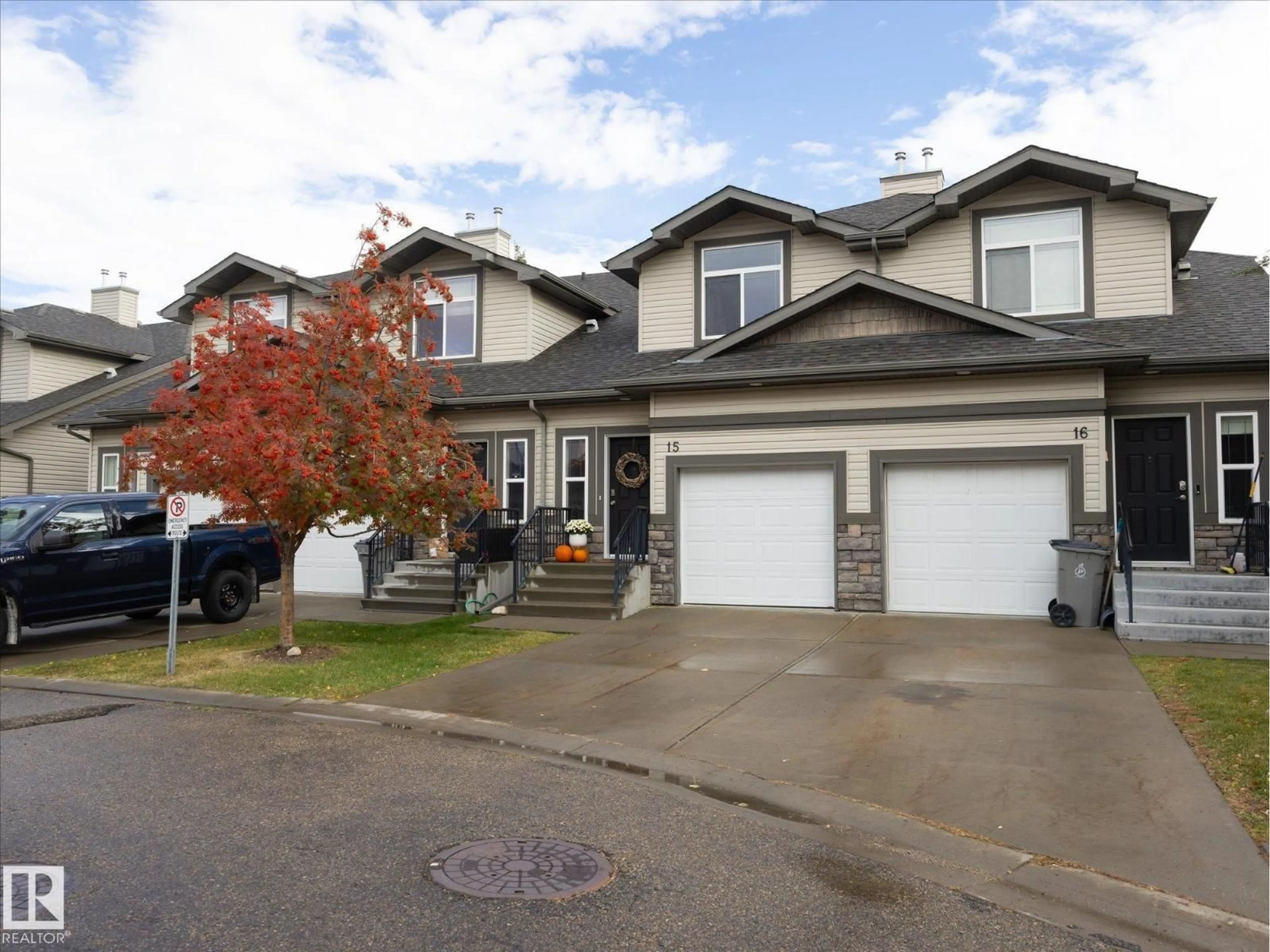 Home with vinyl exterior material, street for 15 - 9511 102 AV, Morinville Alberta T8R0C6