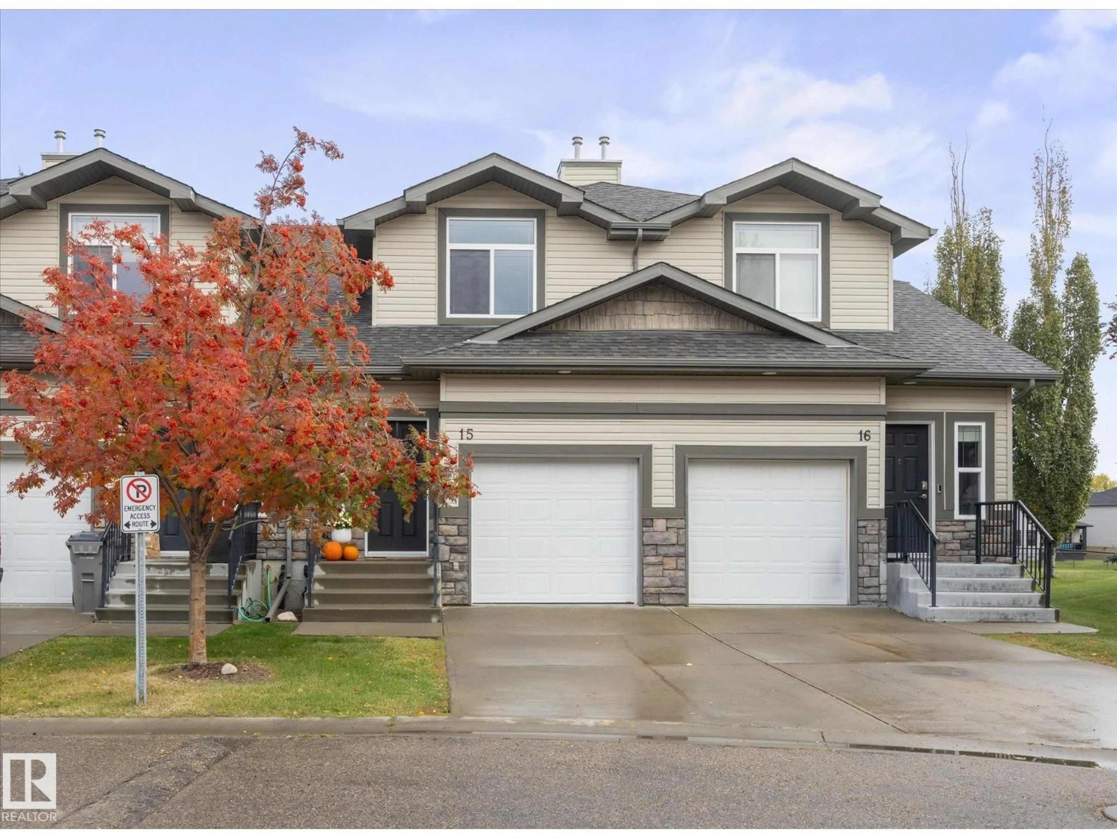 Home with vinyl exterior material, street for 15 - 9511 102 AV, Morinville Alberta T8R0C6