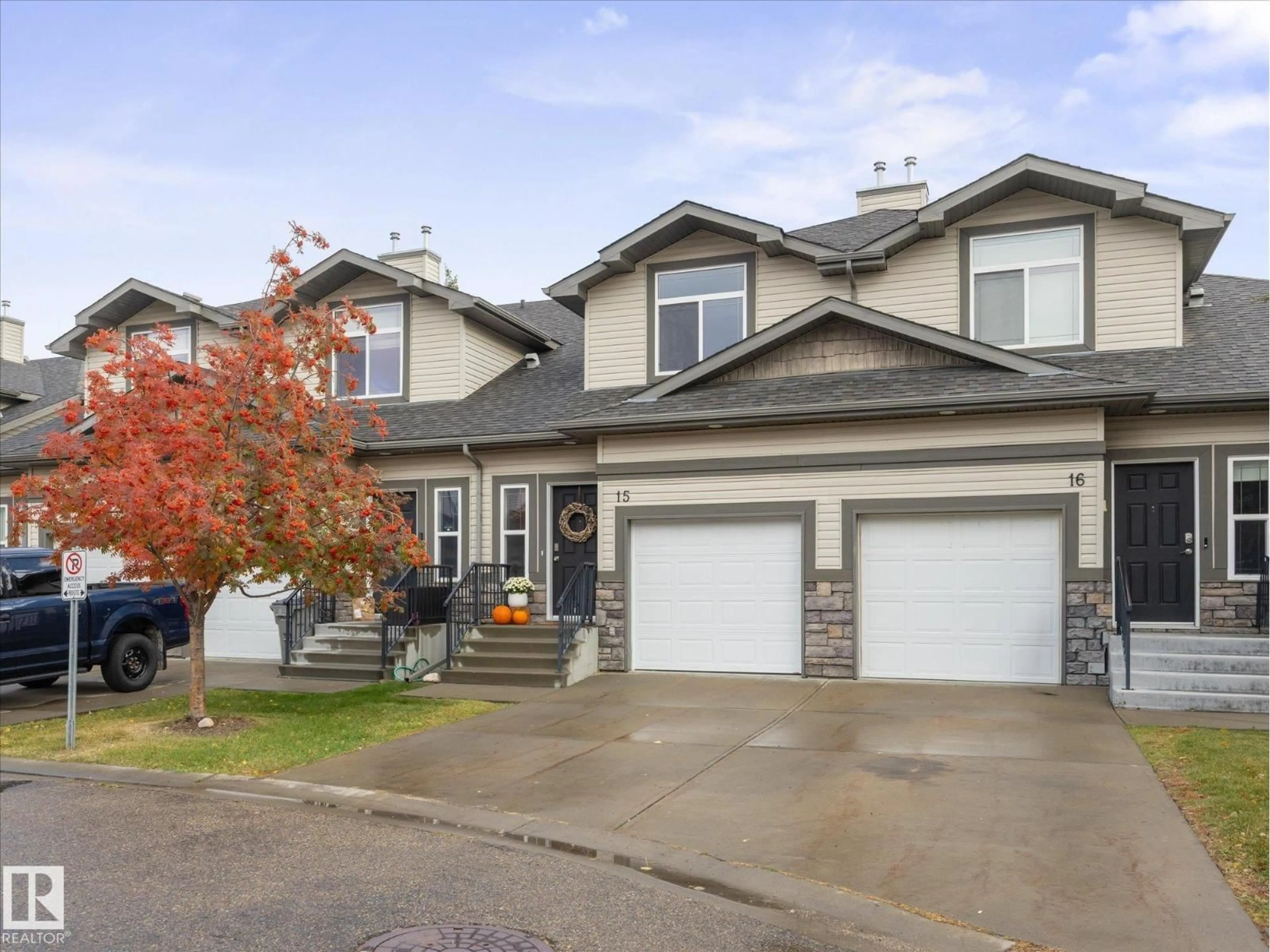Home with vinyl exterior material, street for 15 - 9511 102 AV, Morinville Alberta T8R0C6