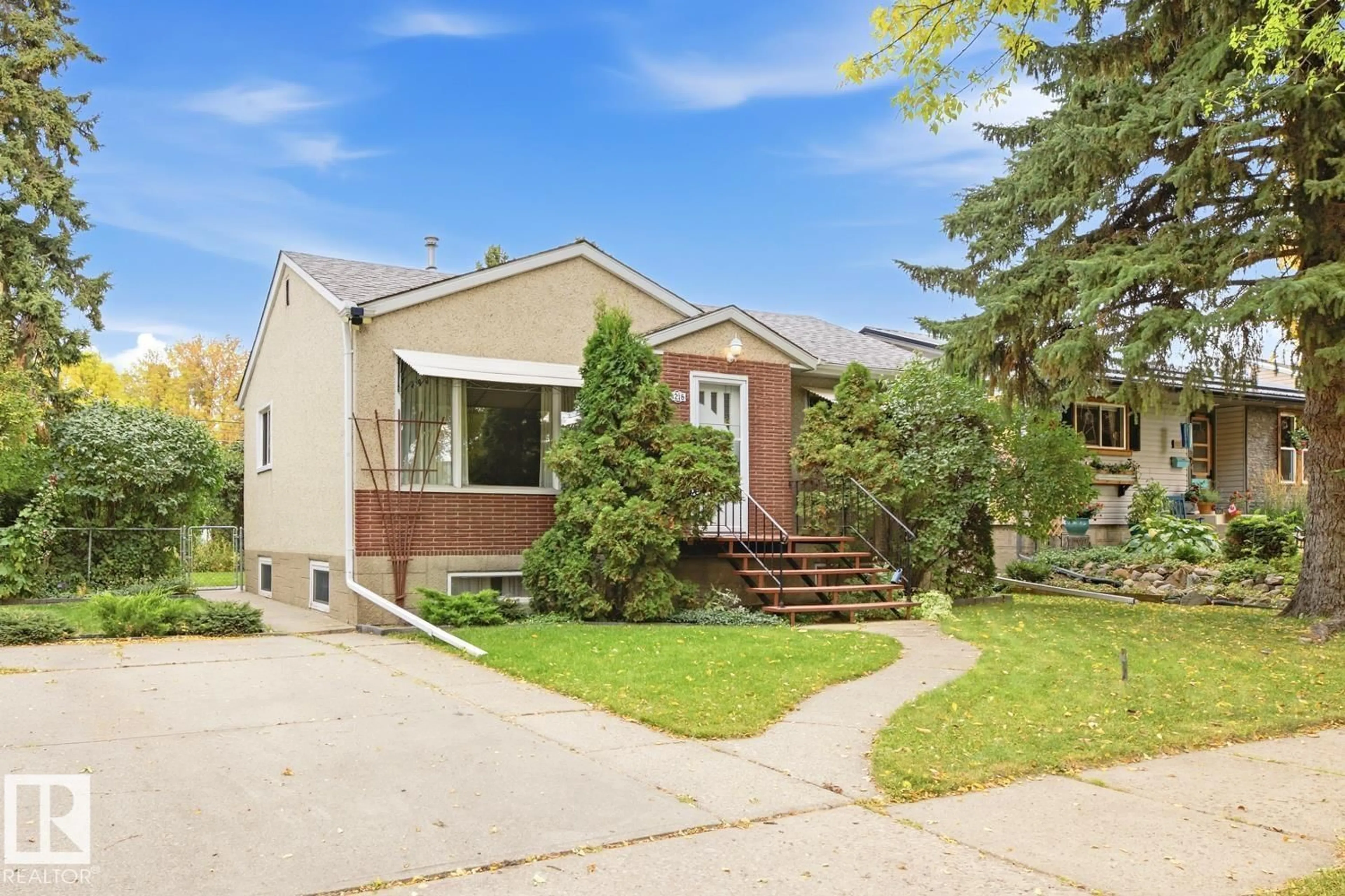 Home with brick exterior material, street for 4218 111 AV, Edmonton Alberta T5W0K2