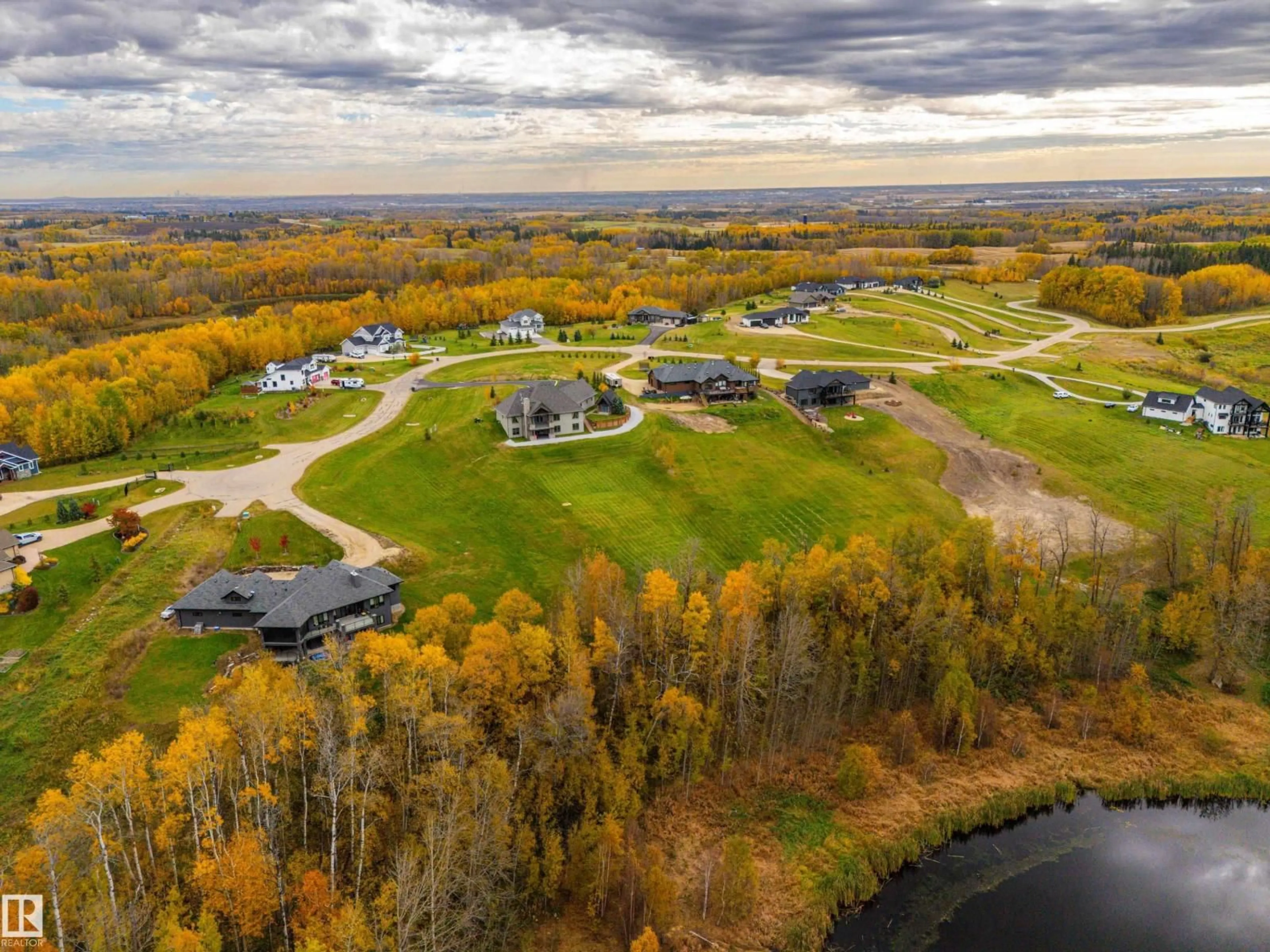 A pic from outside/outdoor area/front of a property/back of a property/a pic from drone, water/lake/river/ocean view for 24 1118 TWP ROAD ROAD, Rural Parkland County Alberta T7Y0B6