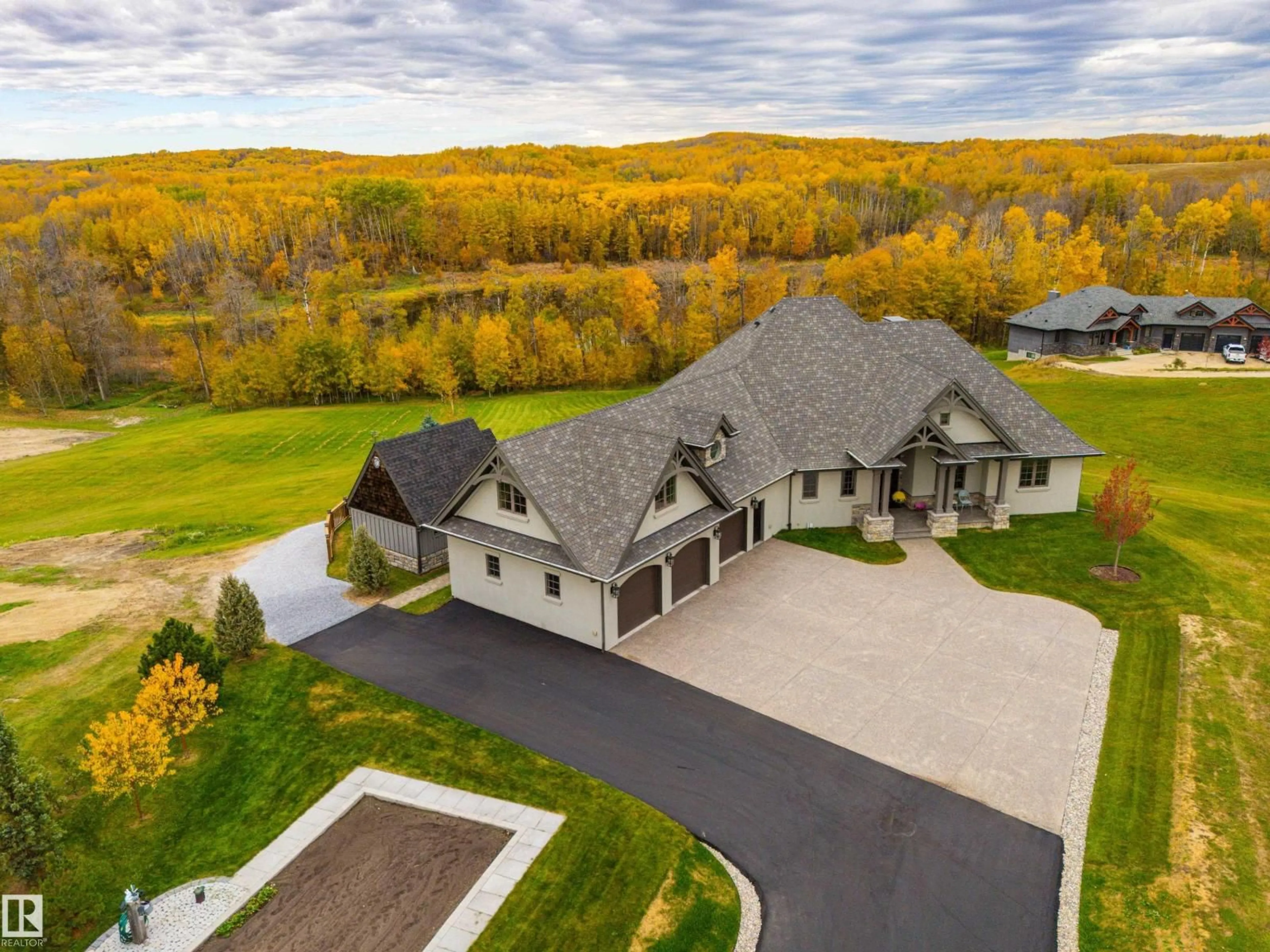 A pic from outside/outdoor area/front of a property/back of a property/a pic from drone, mountain view for 24 1118 TWP ROAD ROAD, Rural Parkland County Alberta T7Y0B6