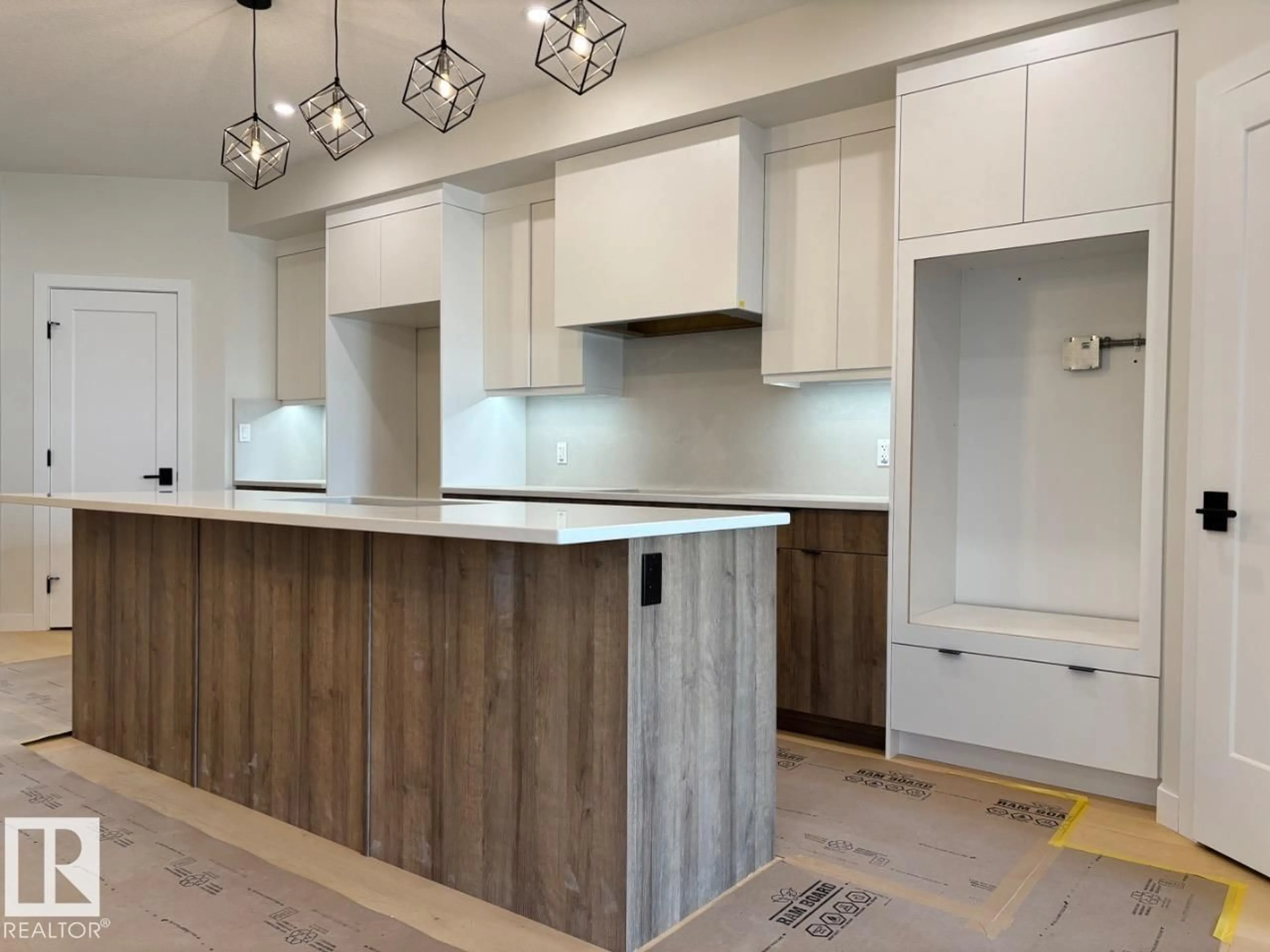Open concept kitchen, wood/laminate floor for 7928 97 AV, Edmonton Alberta T6C2B7