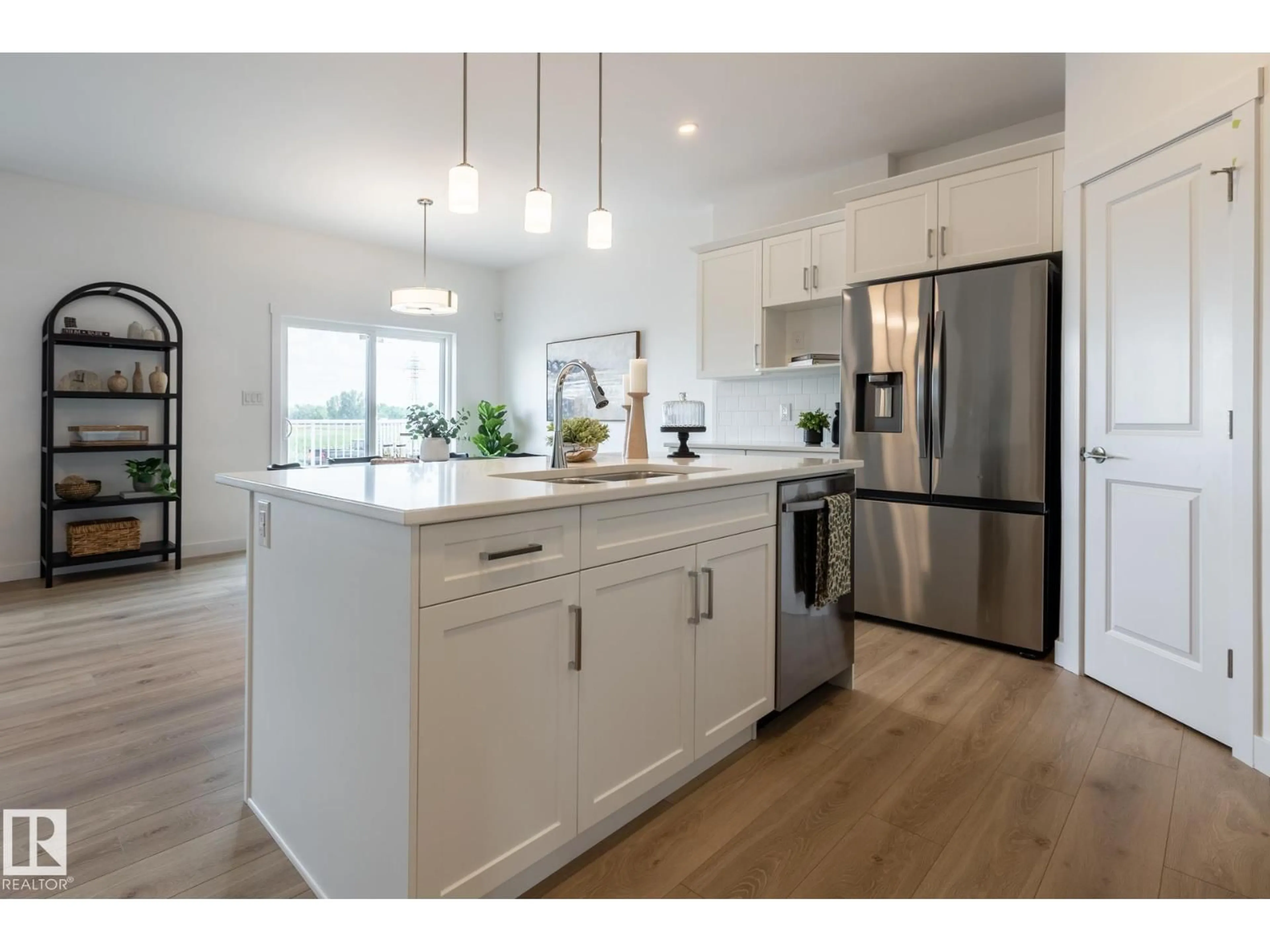 Open concept kitchen, wood/laminate floor for NE - 307 158 AV, Edmonton Alberta T5Y4M5