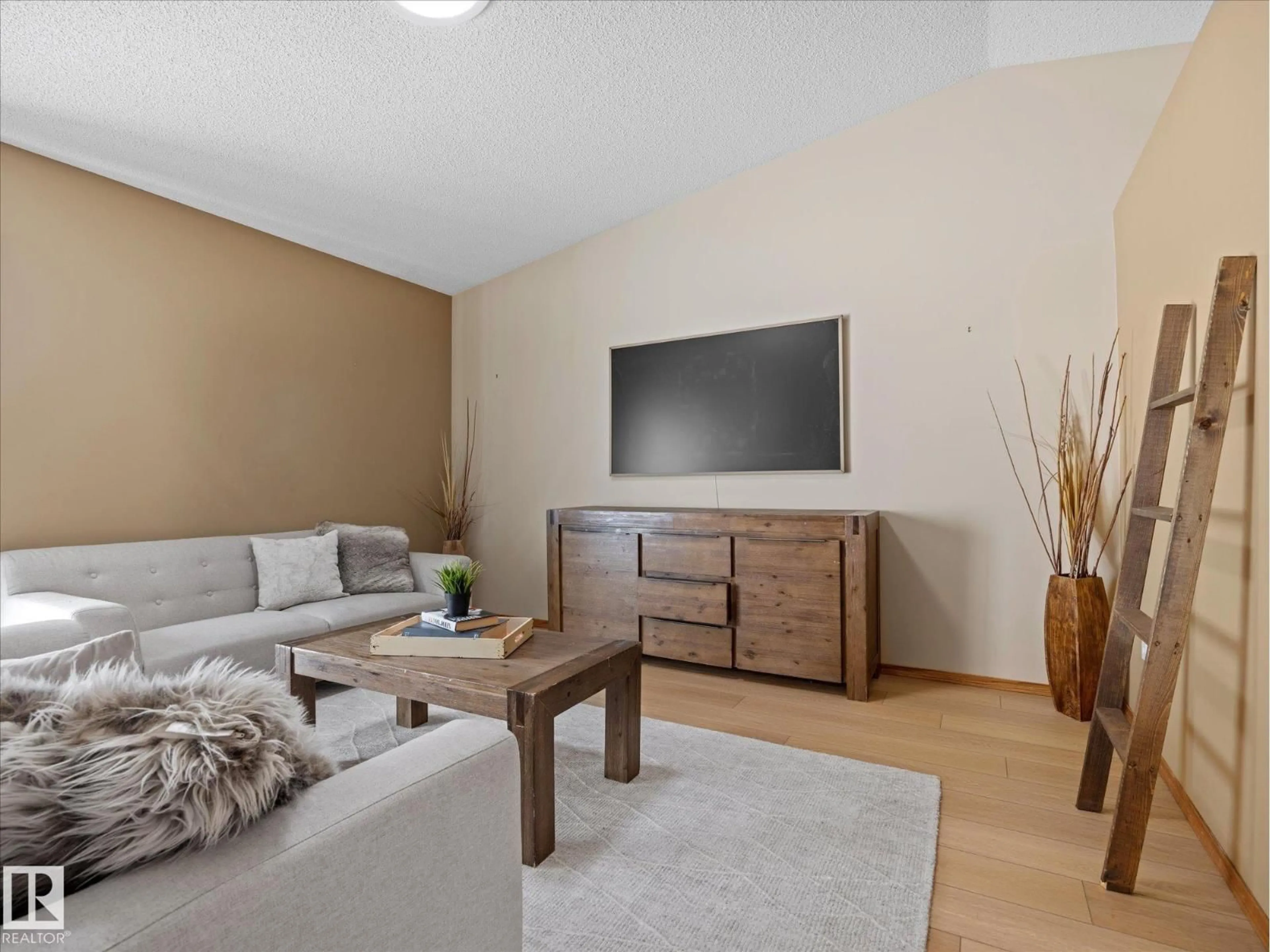 Living room with furniture, wood/laminate floor for 57A - 18 ERIN RIDGE DR, St. Albert Alberta T8N6G1