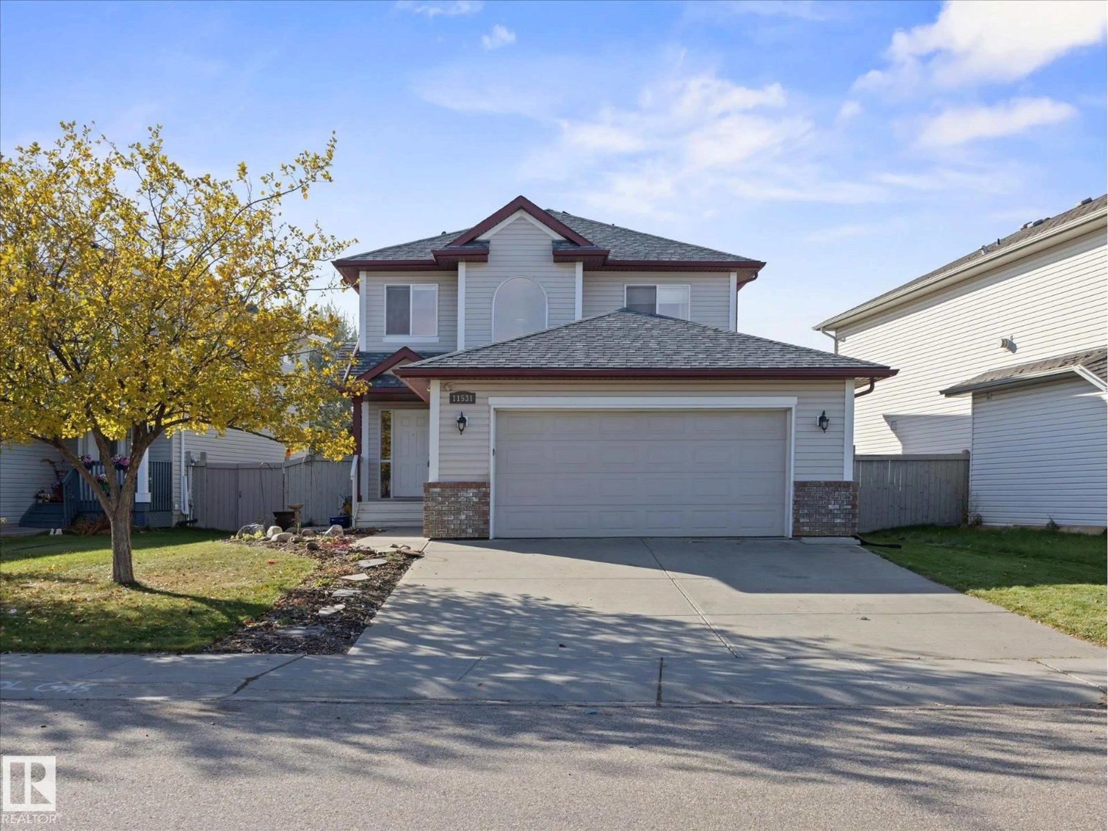 Home with vinyl exterior material, street for 11531 11 AV, Edmonton Alberta T6W1W7