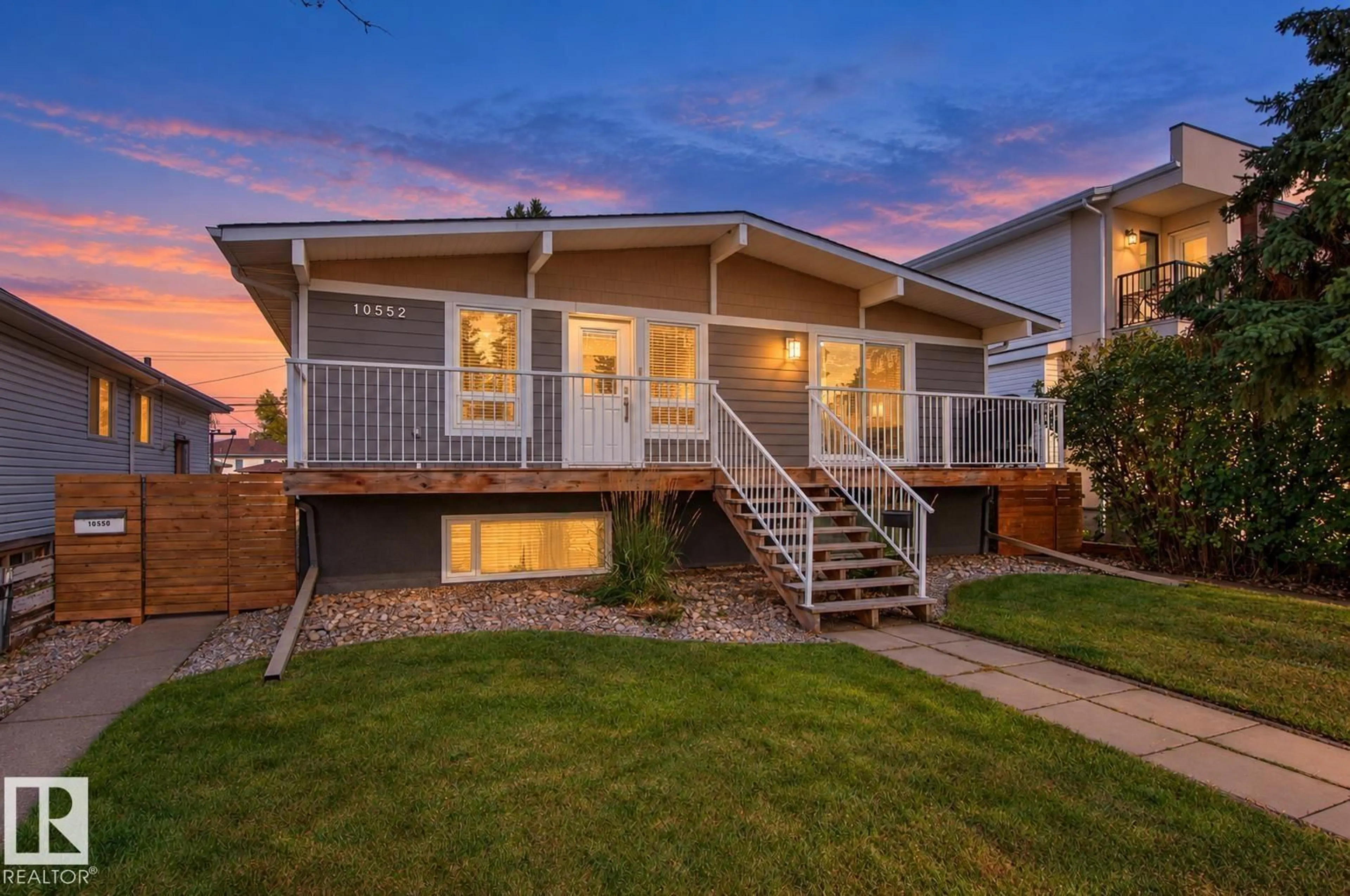 Home with vinyl exterior material, street for 10550, 10552 62 AV NW, Edmonton Alberta T6H1M4