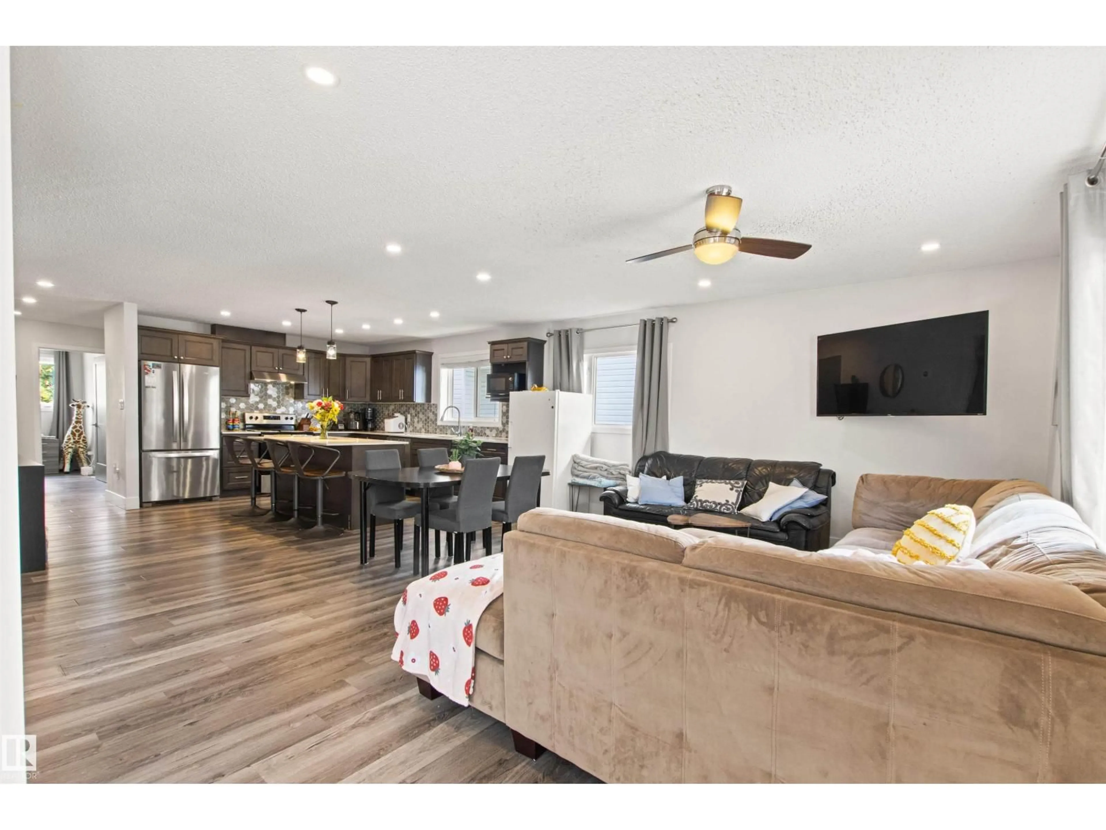Open concept kitchen, wood/laminate floor for 10550, 10552 62 AV NW, Edmonton Alberta T6H1M4