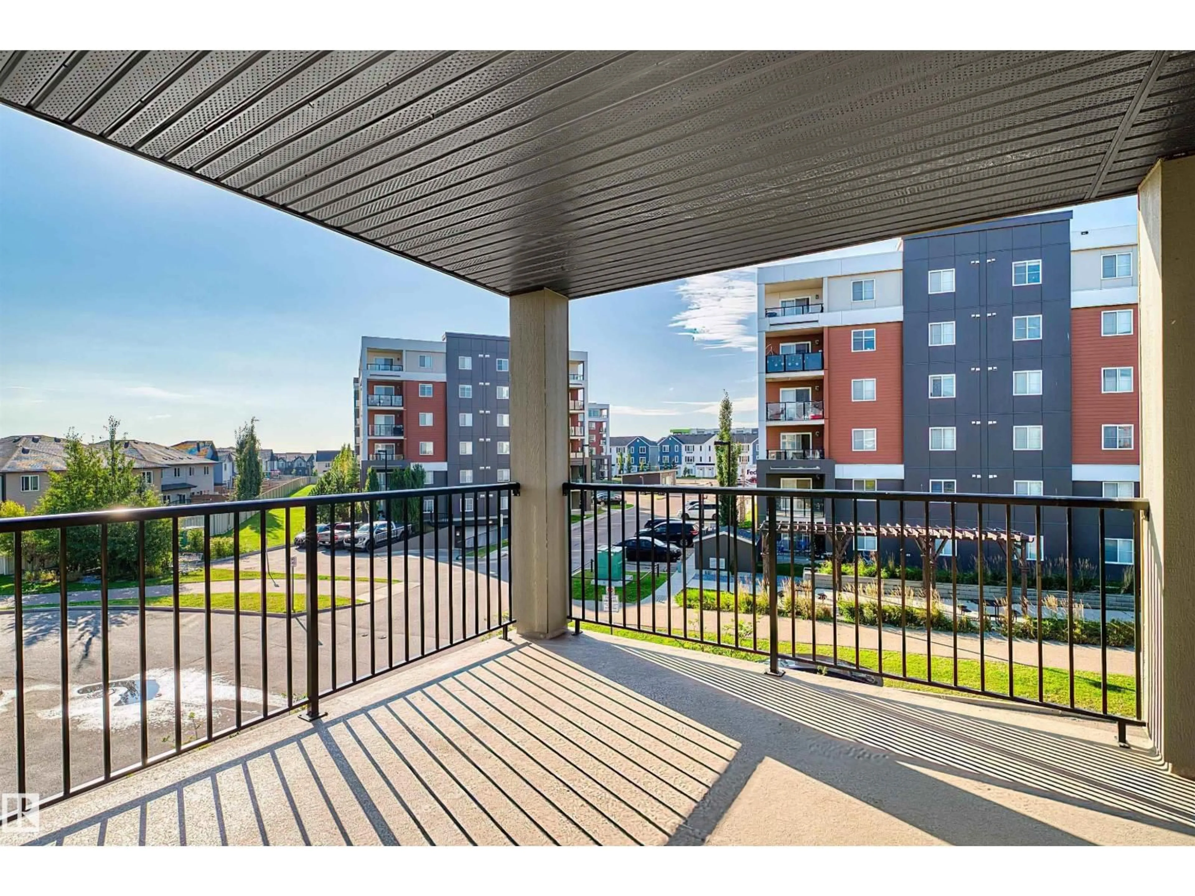 Patio, city buildings view from balcony for #302 - 3315 JAMES MOWATT TR, Edmonton Alberta T6W3L9
