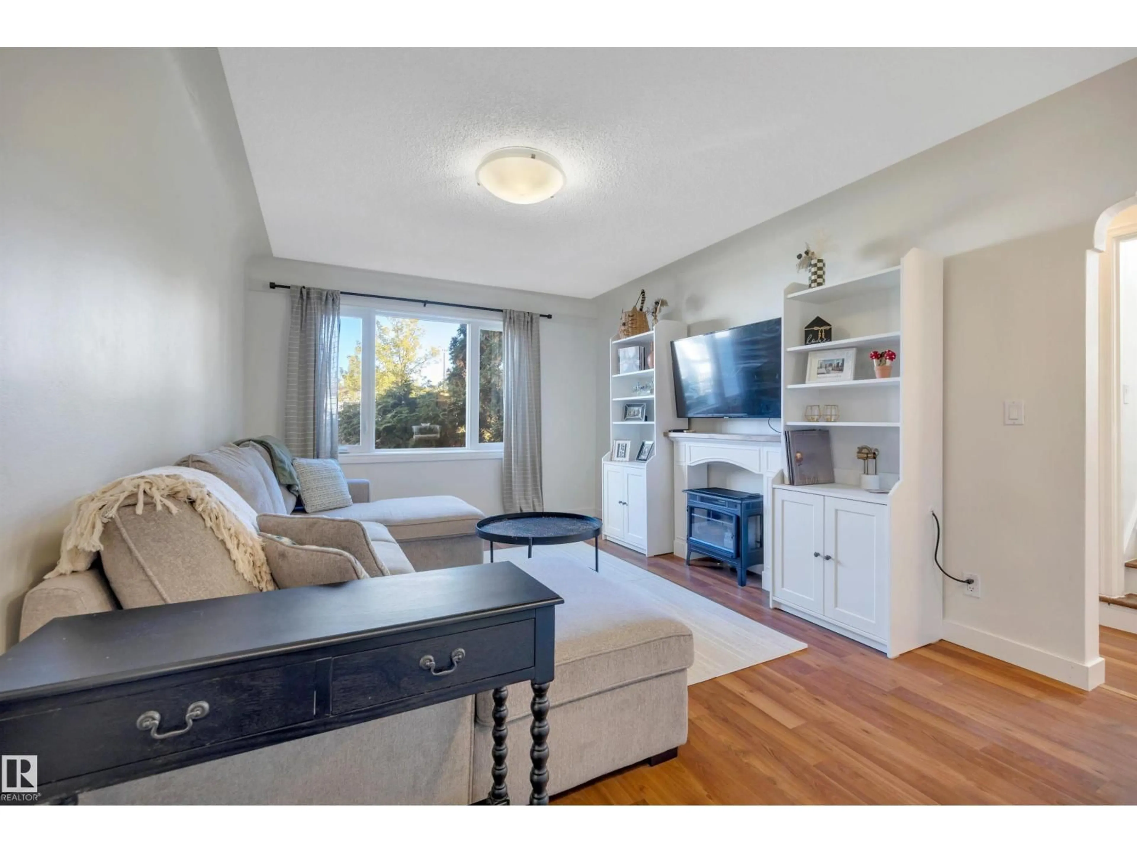 Living room with furniture, unknown for NW - 10647 68 AV, Edmonton Alberta T6H2B3