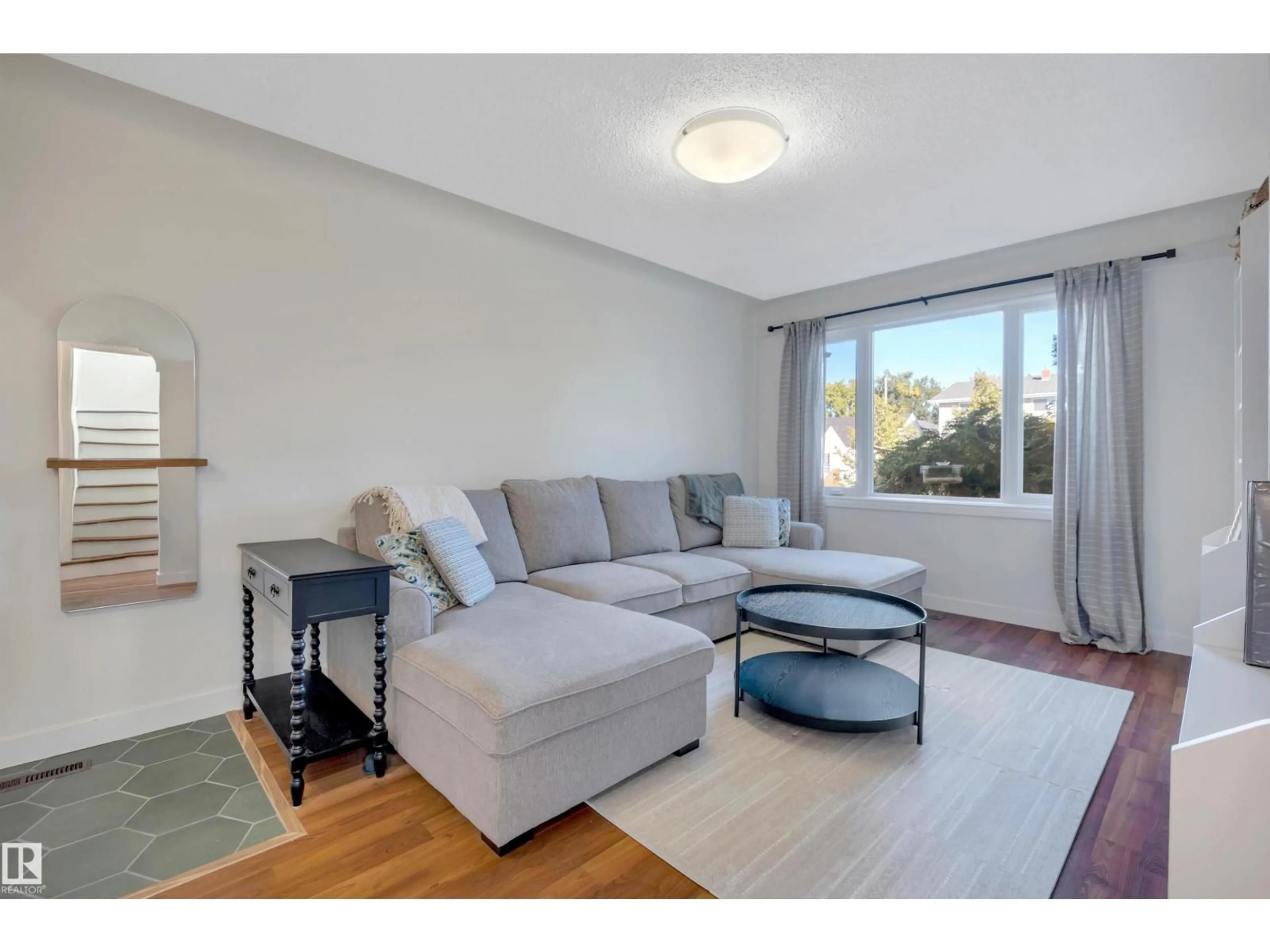 Living room with furniture, unknown for NW - 10647 68 AV, Edmonton Alberta T6H2B3