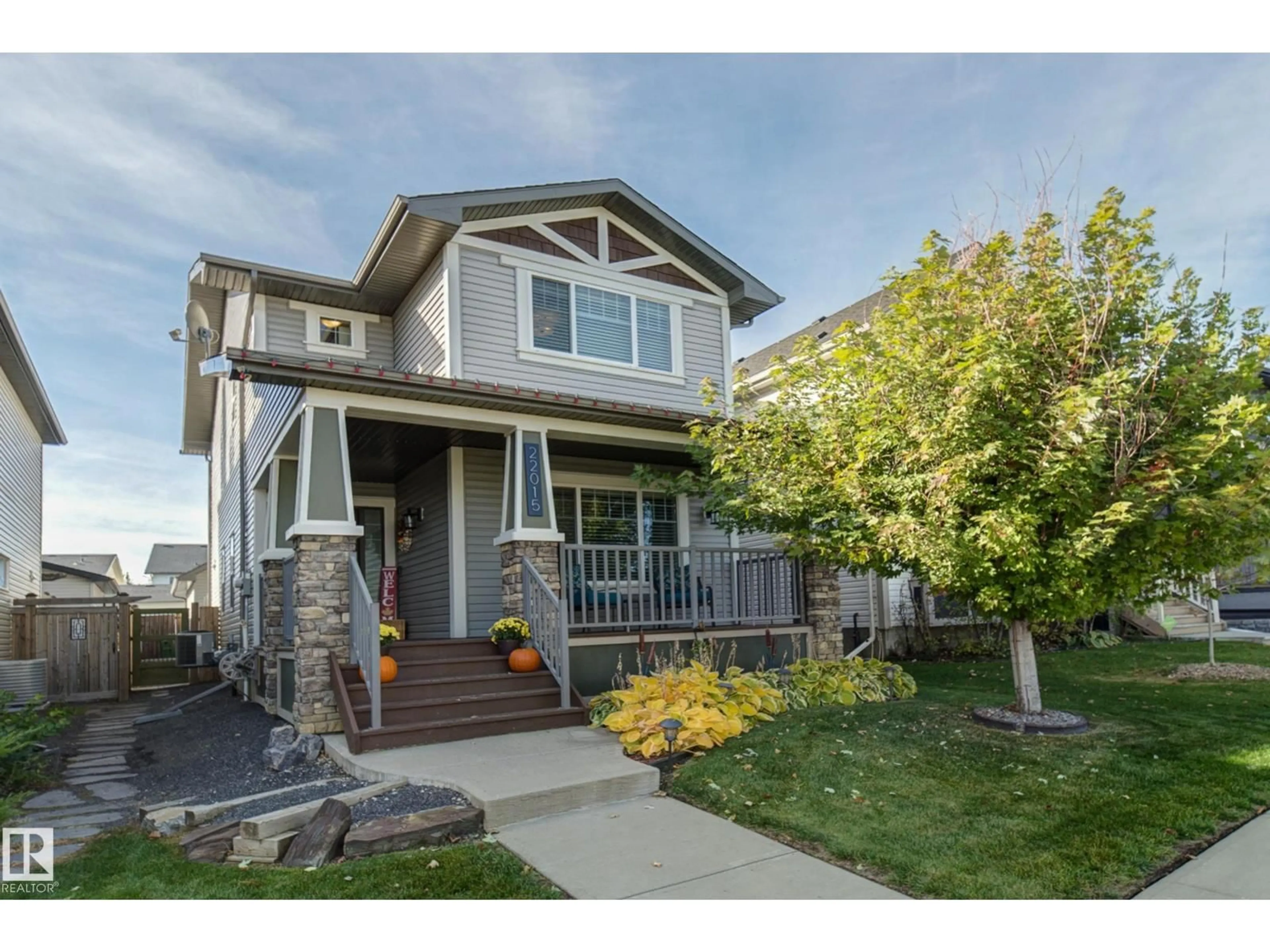 Home with vinyl exterior material, street for 22015 97 AV, Edmonton Alberta T5T4H6