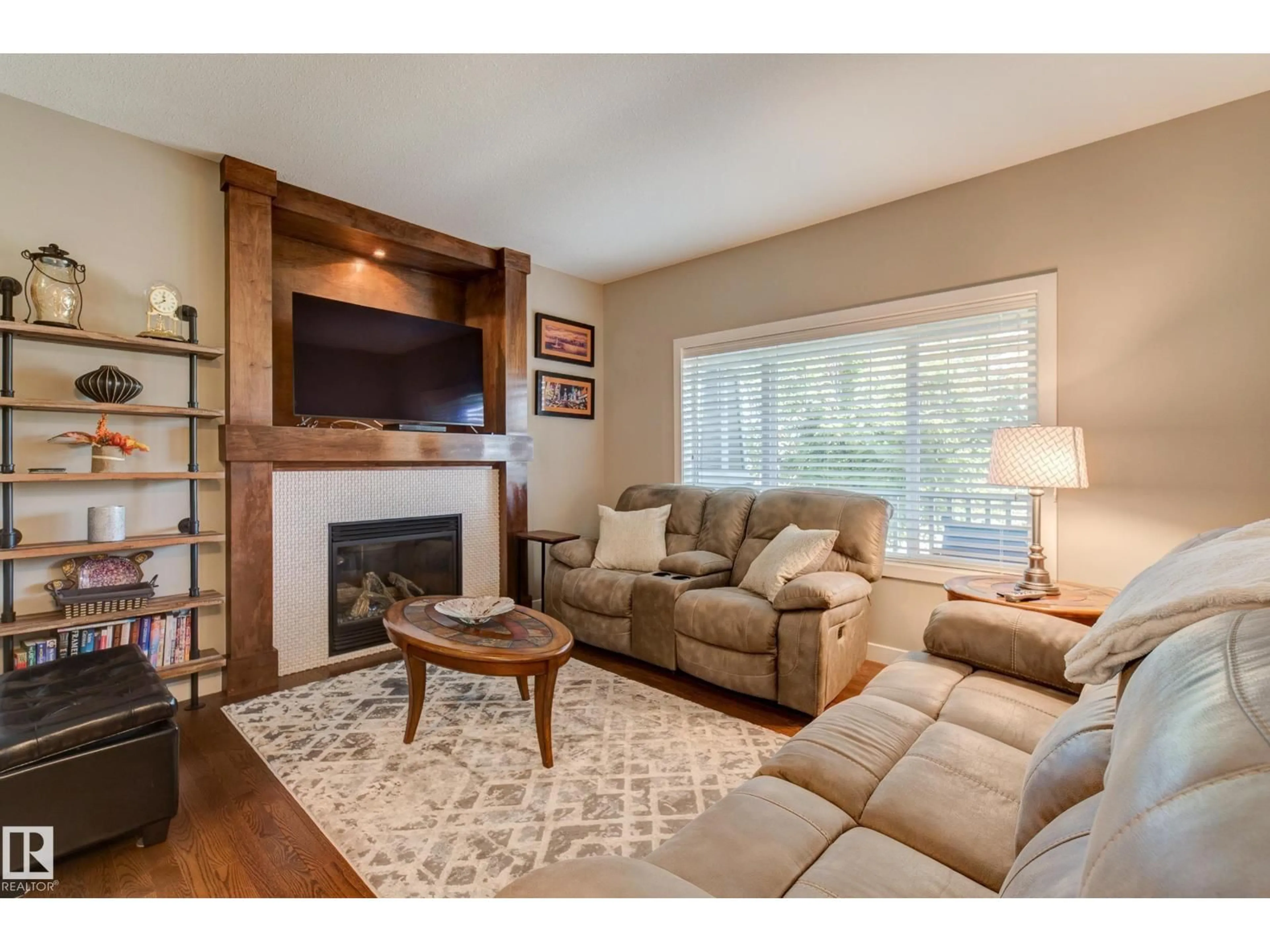 Living room with furniture, wood/laminate floor for 22015 97 AV, Edmonton Alberta T5T4H6