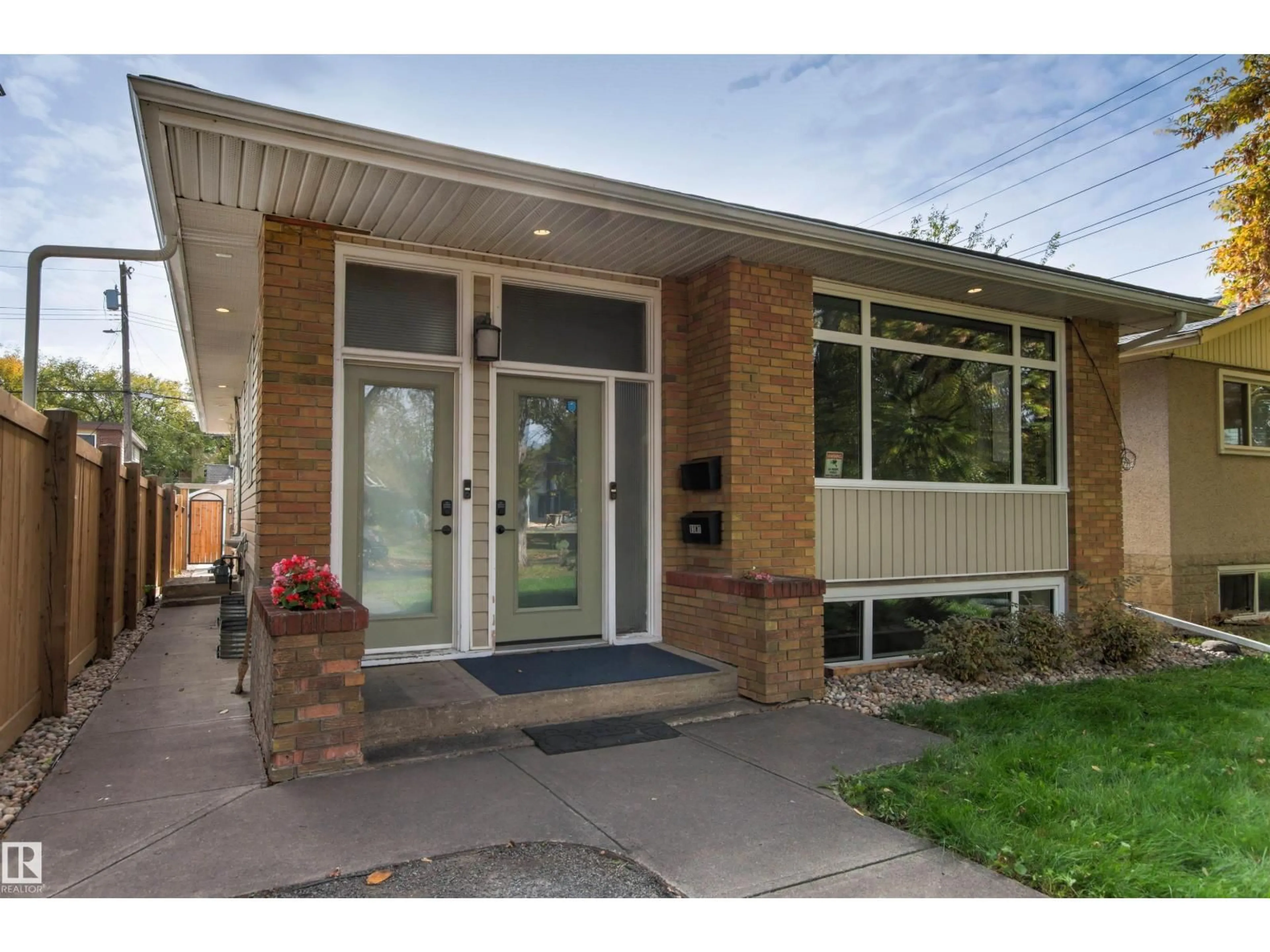 Home with brick exterior material, street for 10753 79 AV, Edmonton Alberta T6E1S4
