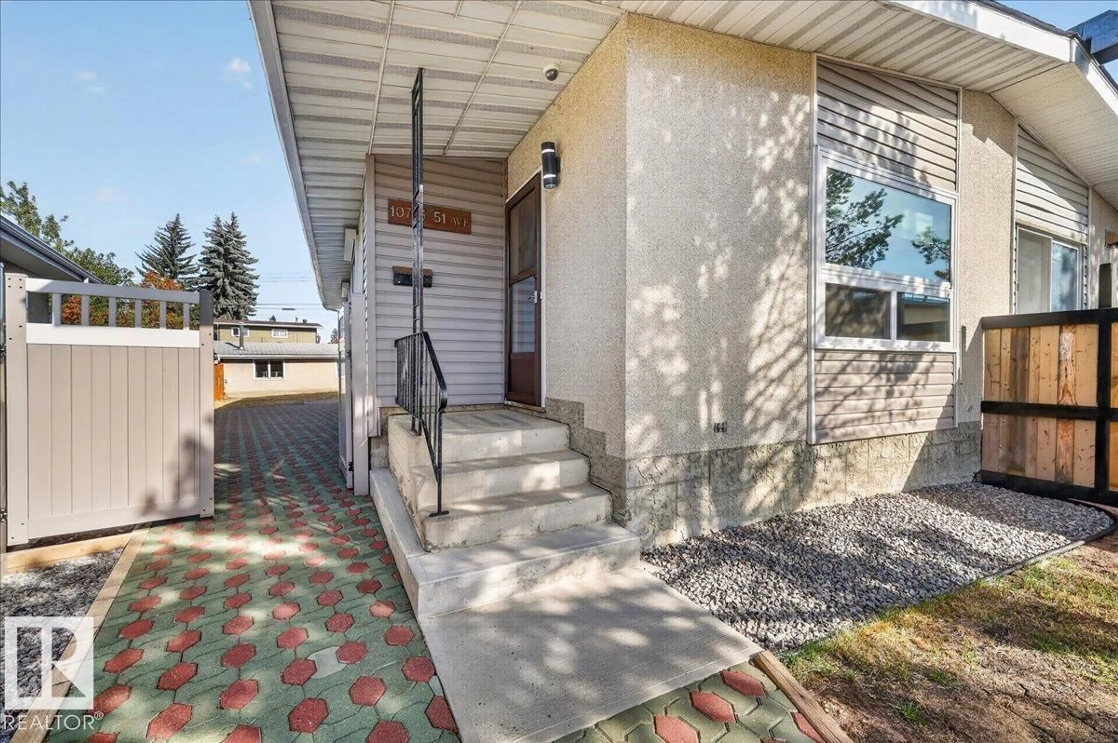 Home with vinyl exterior material, street for 10716 51 AV, Edmonton Alberta T6H0L2