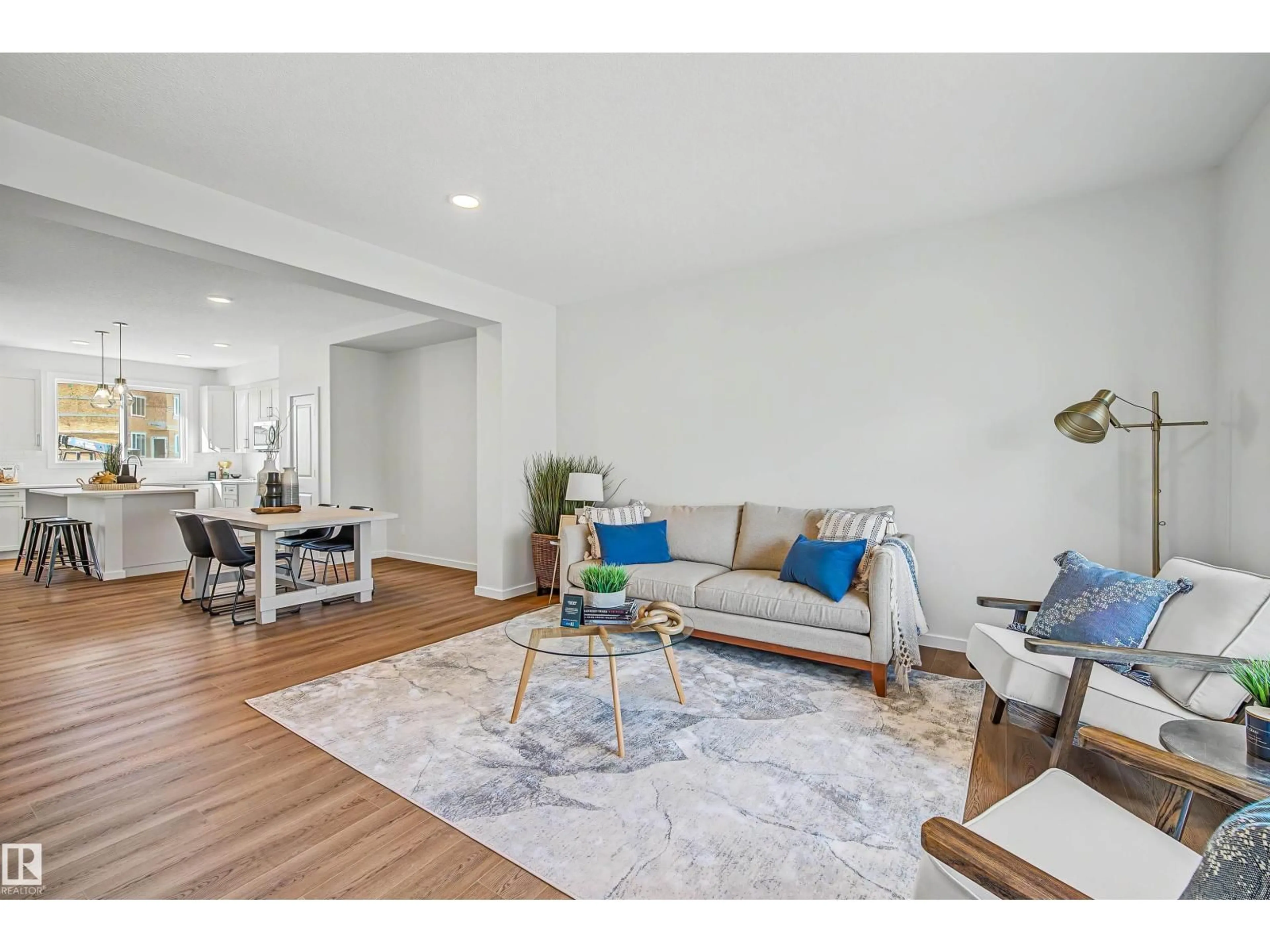 Living room with furniture, wood/laminate floor for 3028 192 ST, Edmonton Alberta T6M3M3