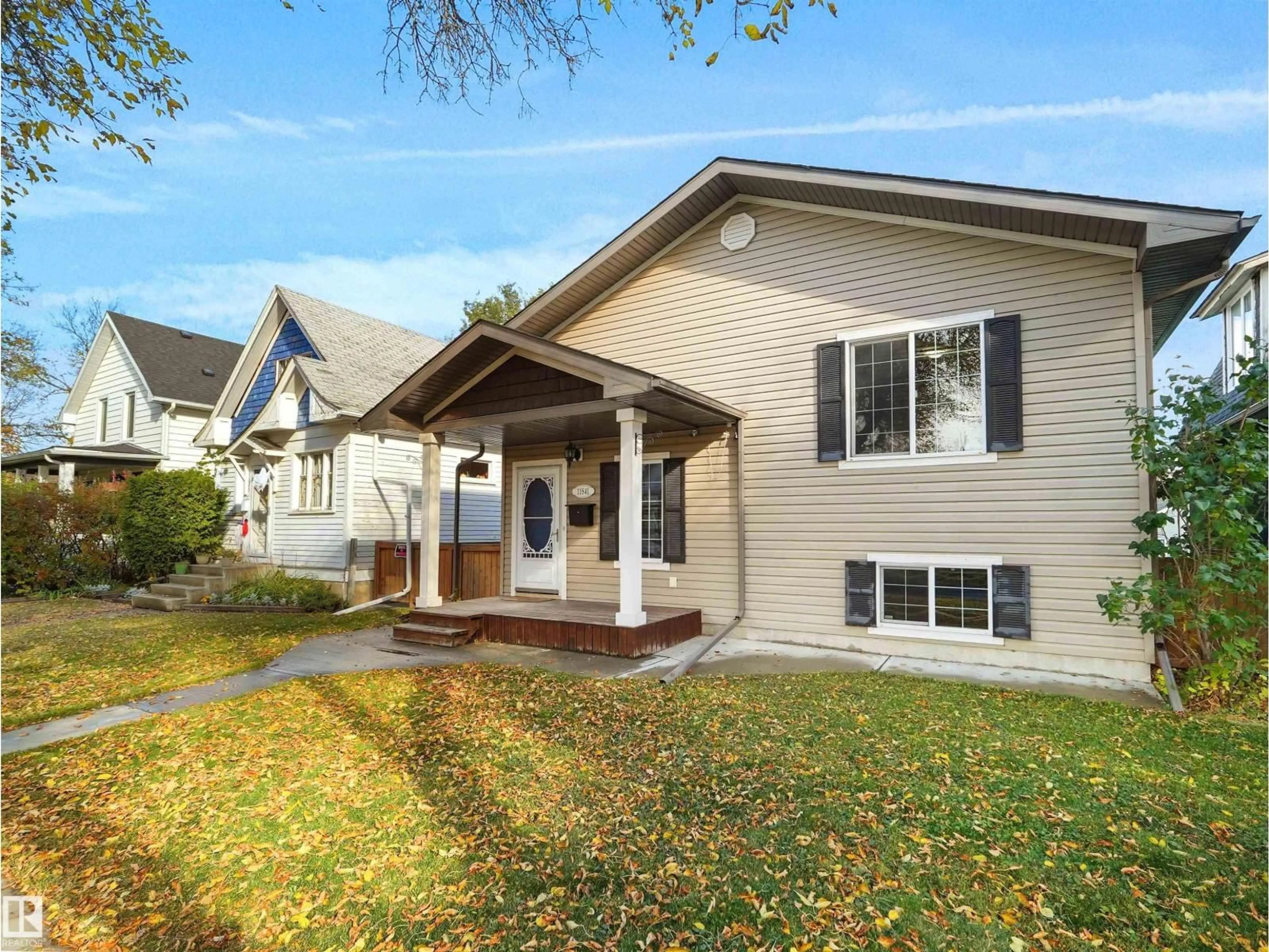 Home with vinyl exterior material, street for 11841 94 ST, Edmonton Alberta T5G1J3