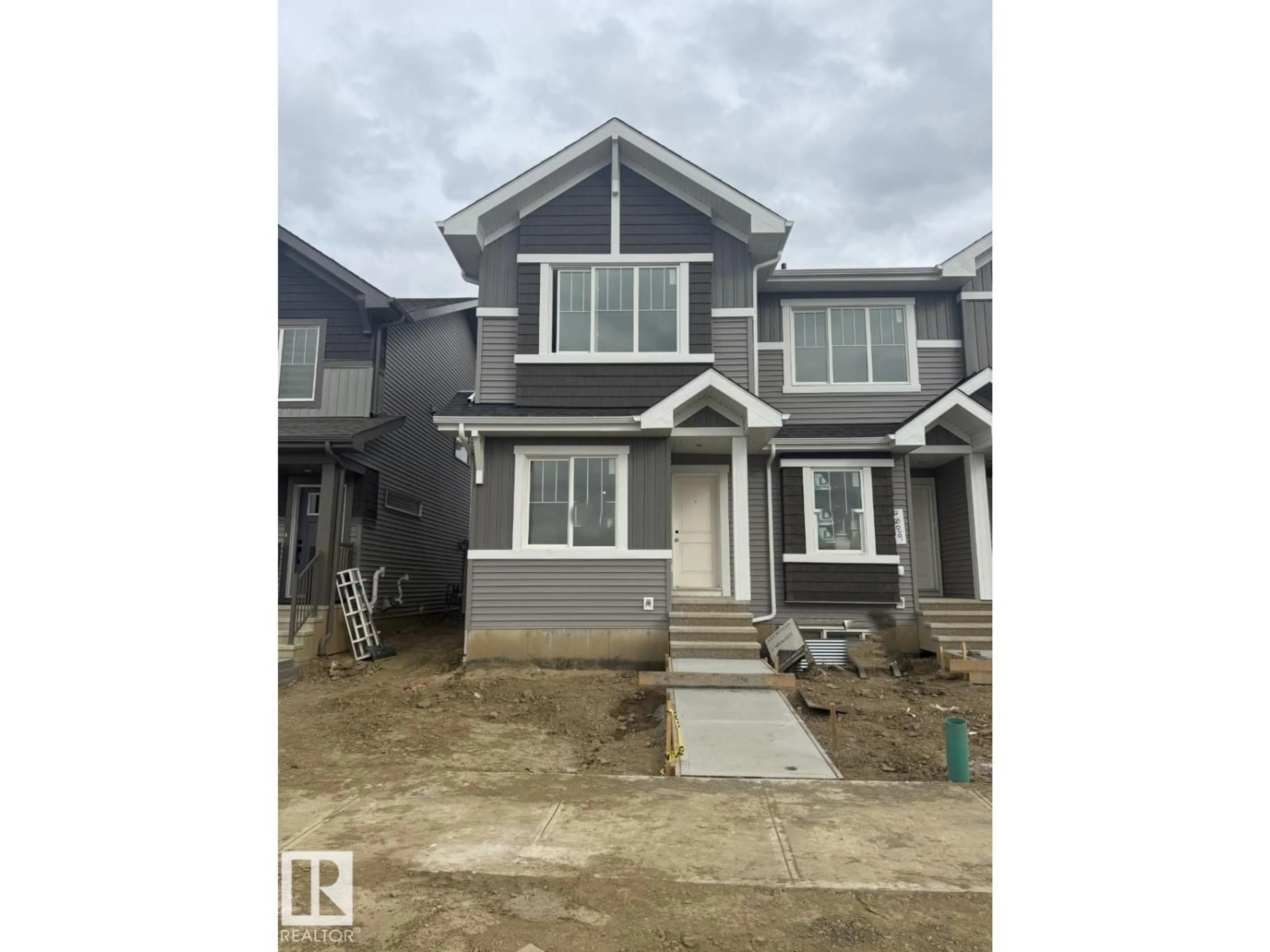 Home with vinyl exterior material, street for 7091 ROSENTHAL DR, Edmonton Alberta T5T7L4