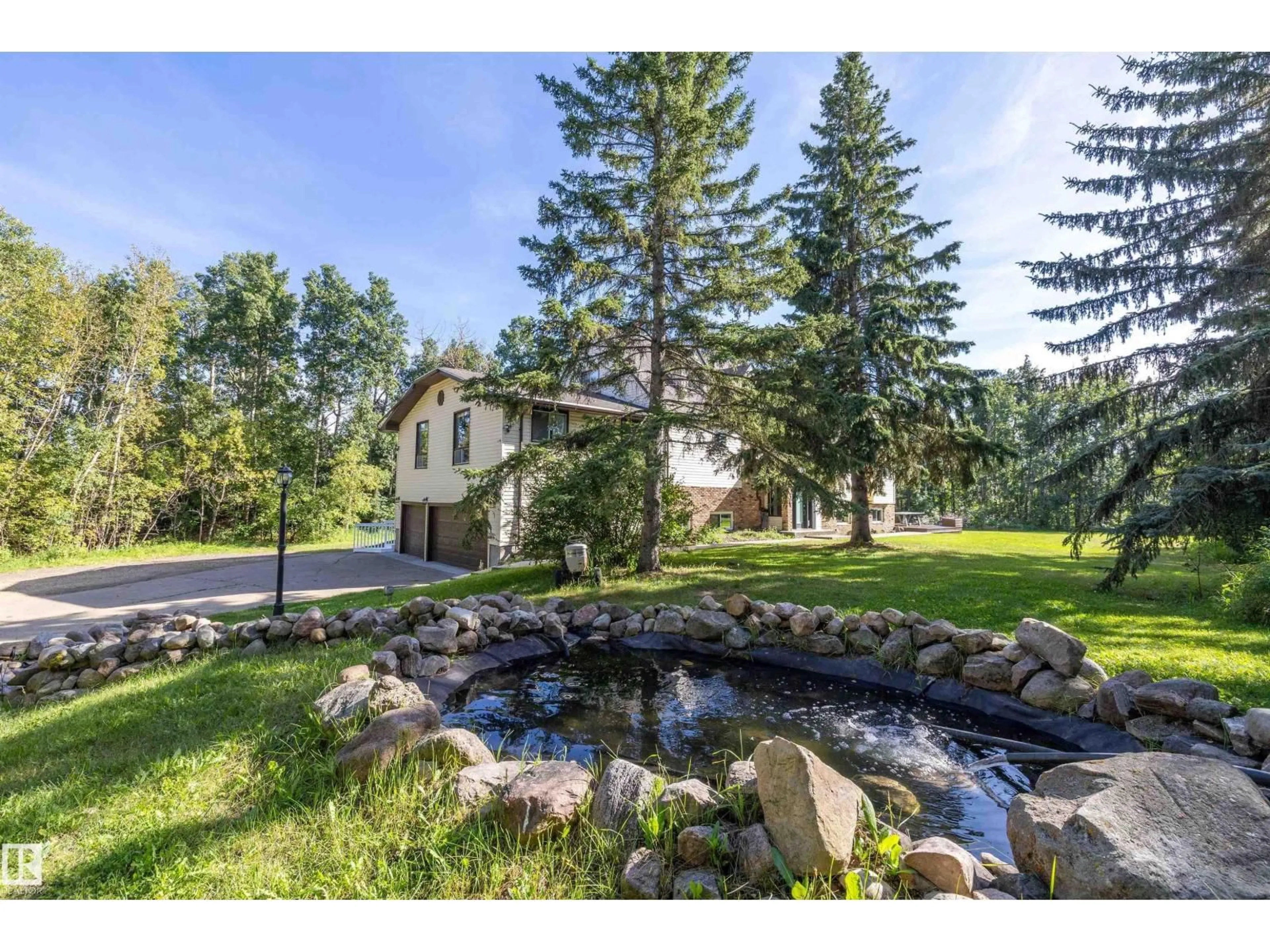 A pic from outside/outdoor area/front of a property/back of a property/a pic from drone, water/lake/river/ocean view for 52470 - 73 RANGE ROAD 221, Rural Strathcona County Alberta T8E2H8