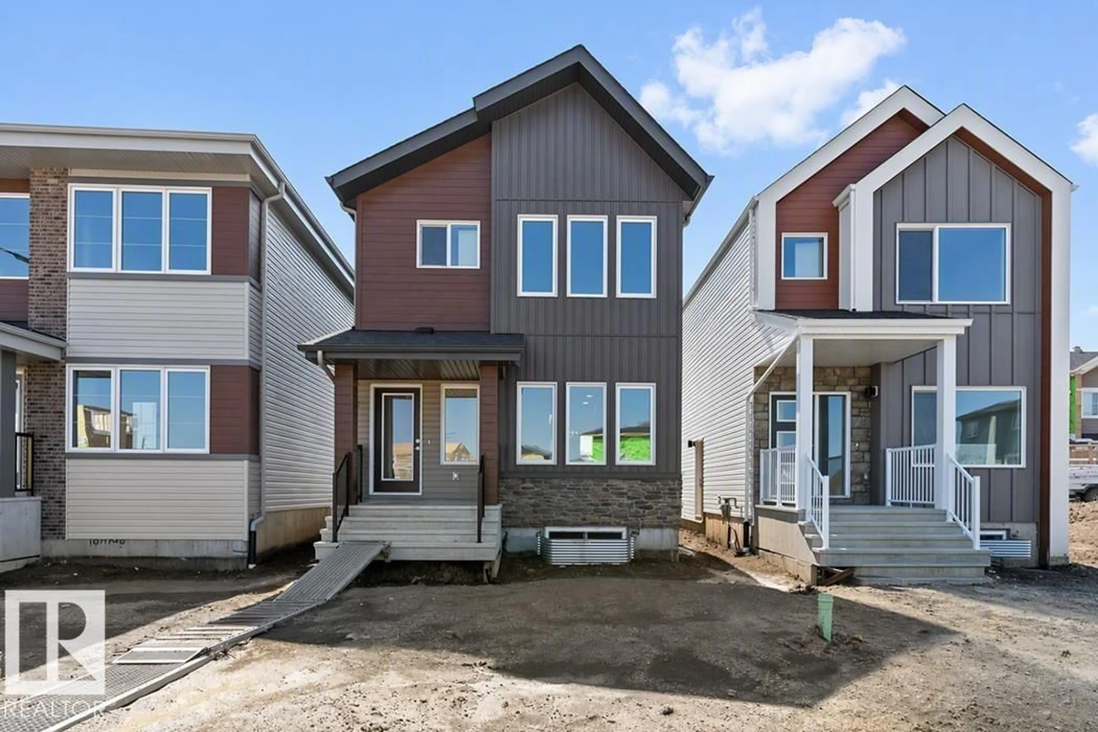 Home with vinyl exterior material, street for 18713 18A AV, Edmonton Alberta T6M0X8
