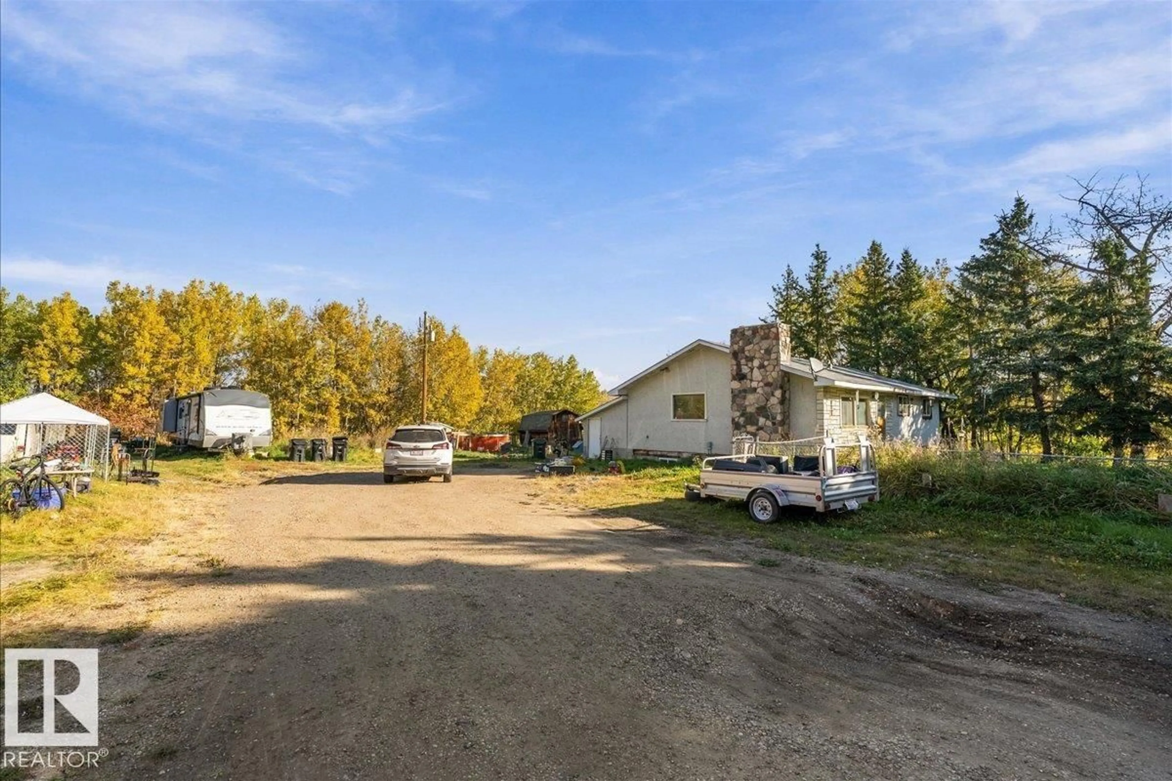 A pic from outside/outdoor area/front of a property/back of a property/a pic from drone, unknown for 22164 TWP ROAD 512, Rural Strathcona County Alberta T8G1E8