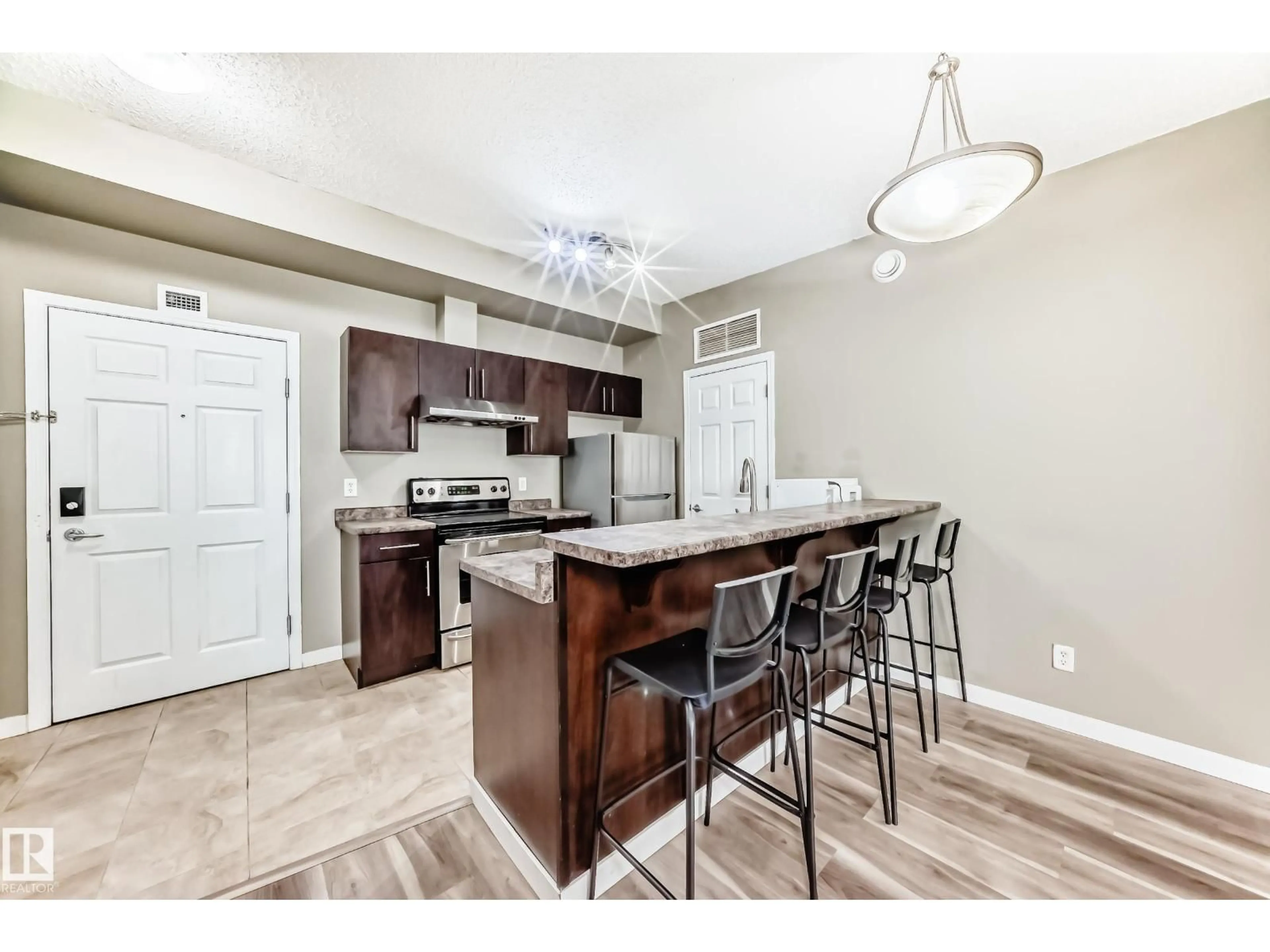 Open concept kitchen, unknown for 411 6925 199 ST NW, Edmonton Alberta T5T3X8