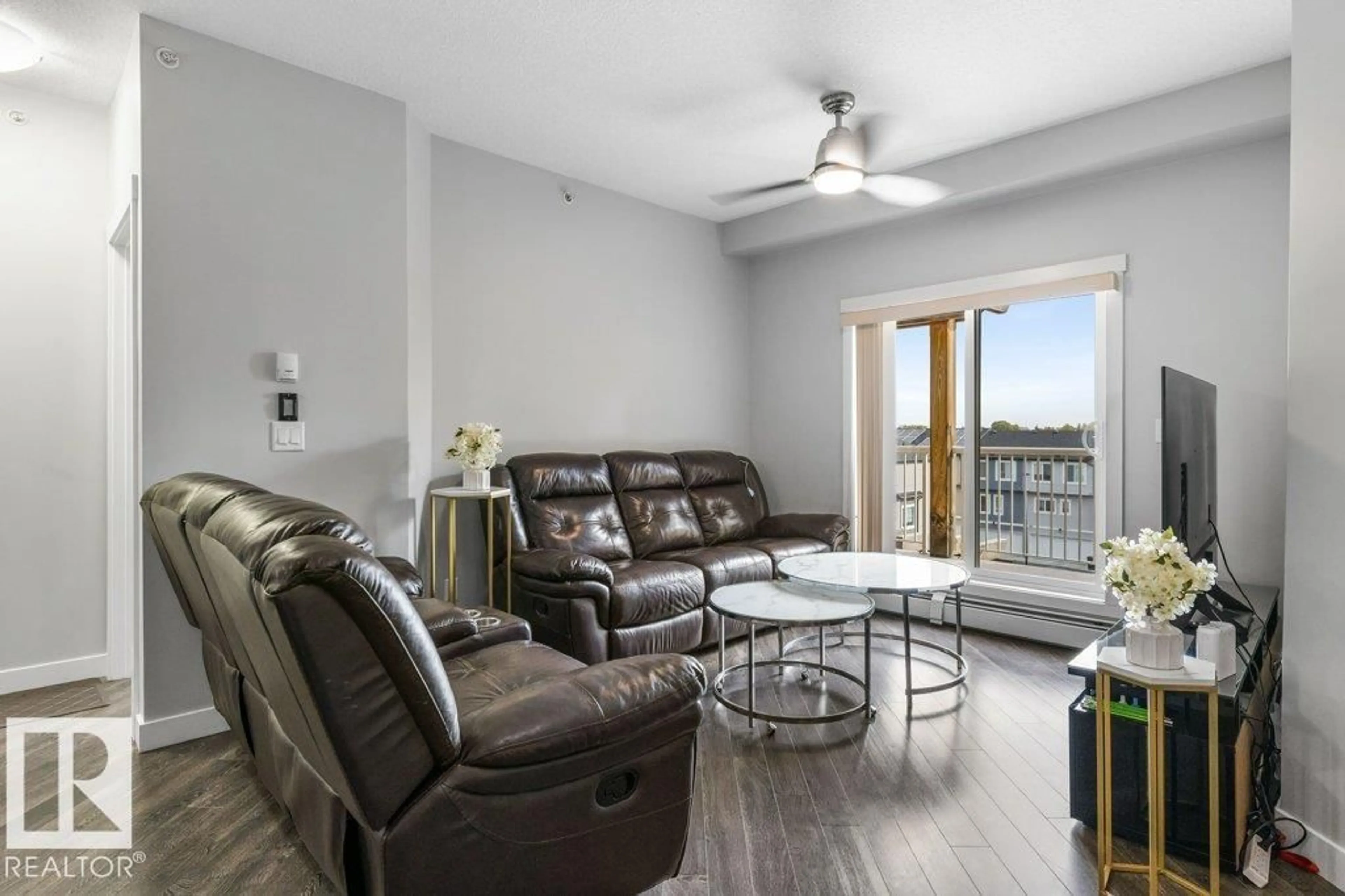 Living room with furniture, wood/laminate floor for #408 - 3670 139 AV, Edmonton Alberta T5Y3N5