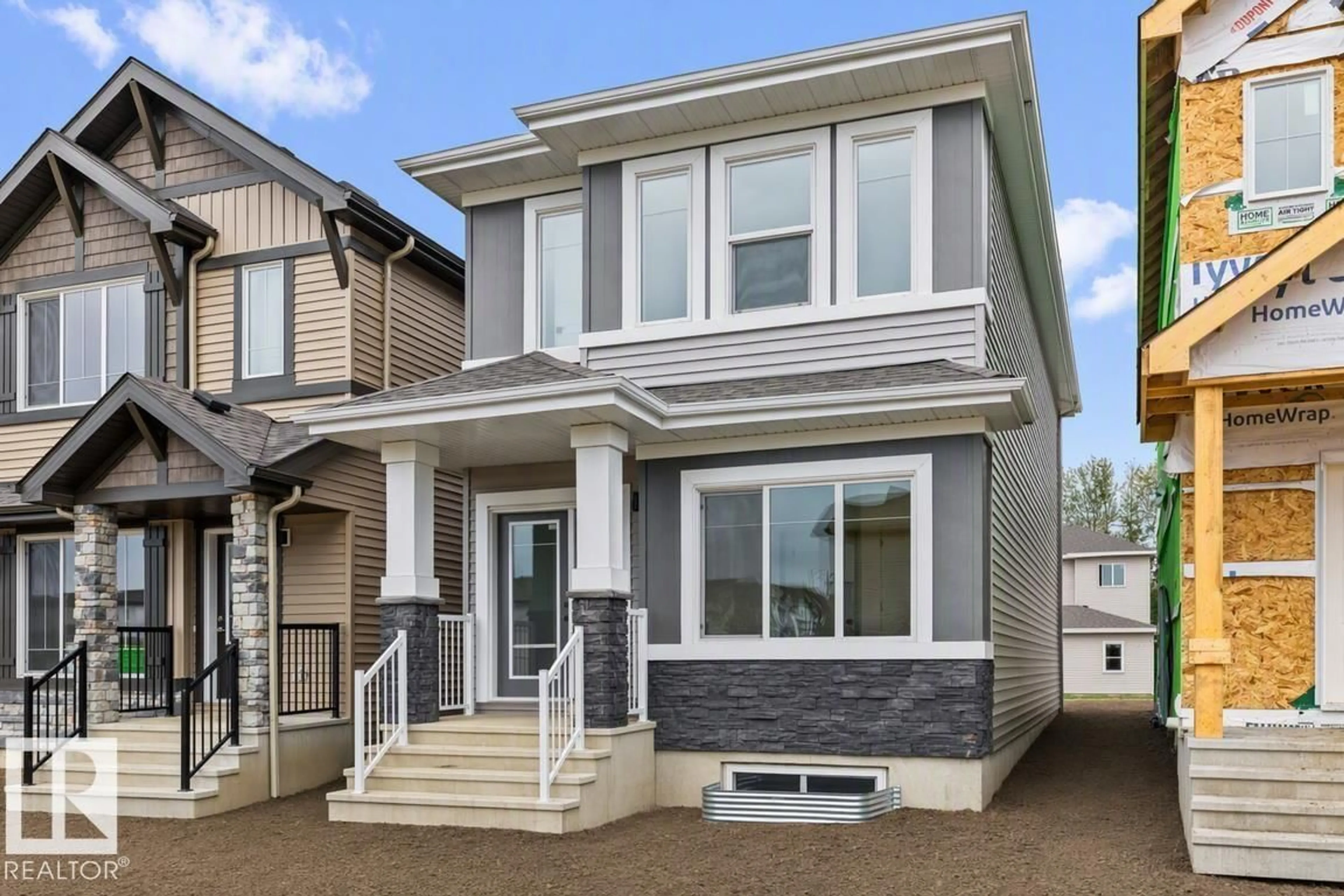 Home with vinyl exterior material, street for NW - 1613 210A ST, Edmonton Alberta T6M3E1
