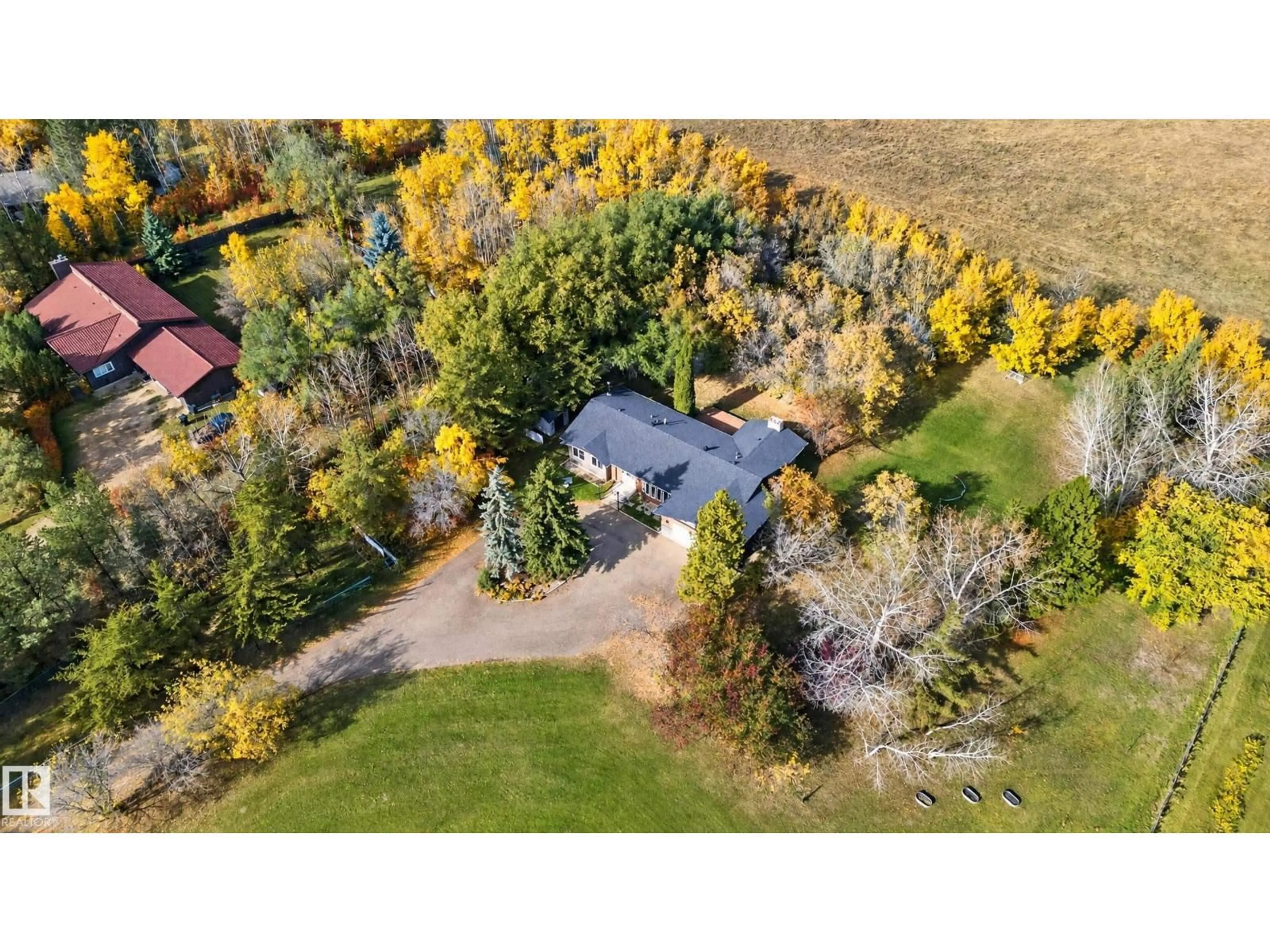 A pic from outside/outdoor area/front of a property/back of a property/a pic from drone, forest/trees view for 26 - 52472 RGE ROAD 224, Rural Strathcona County Alberta T8A4R6