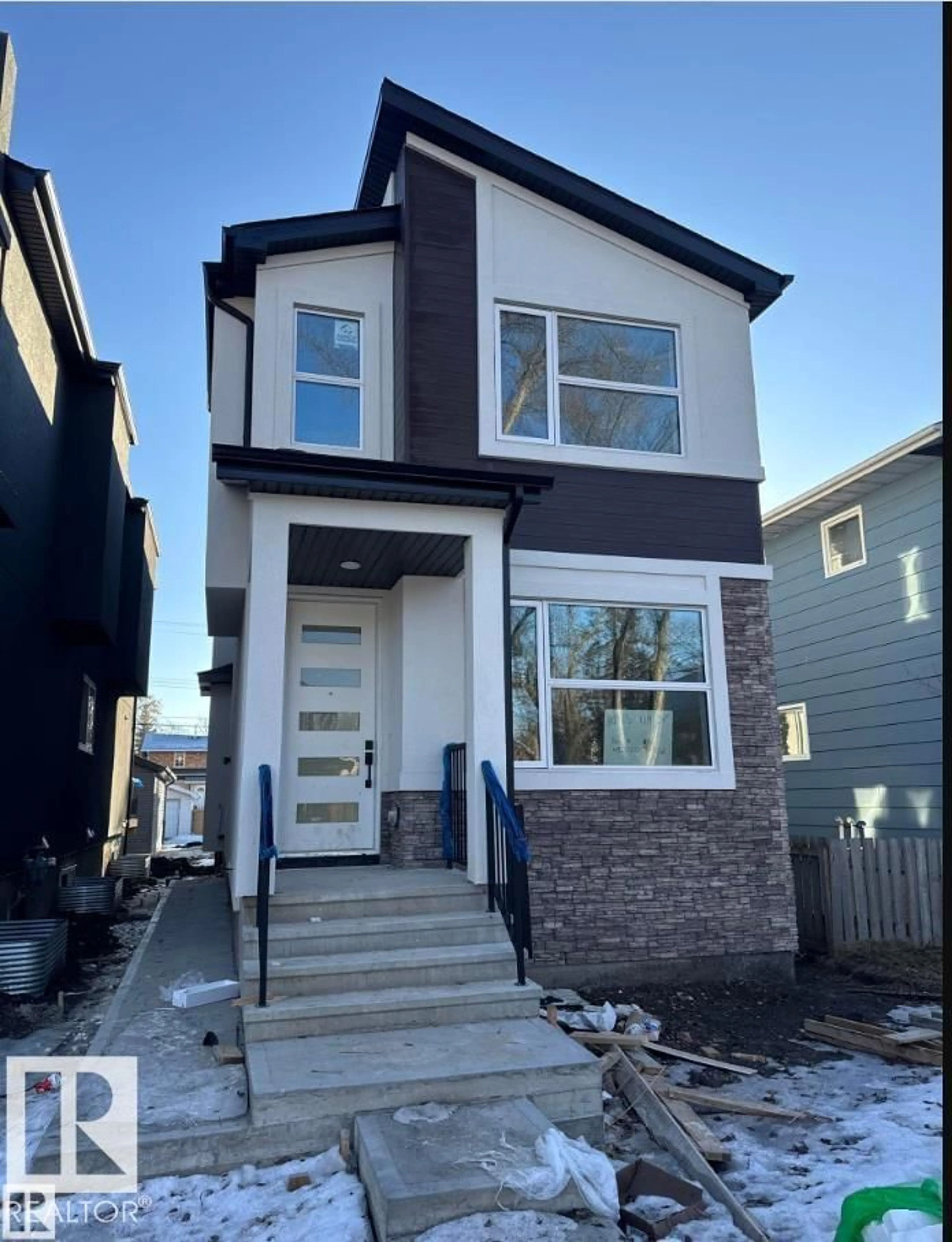 Home with vinyl exterior material, street for NW - 10963 129 ST, Edmonton Alberta T5M0Y2