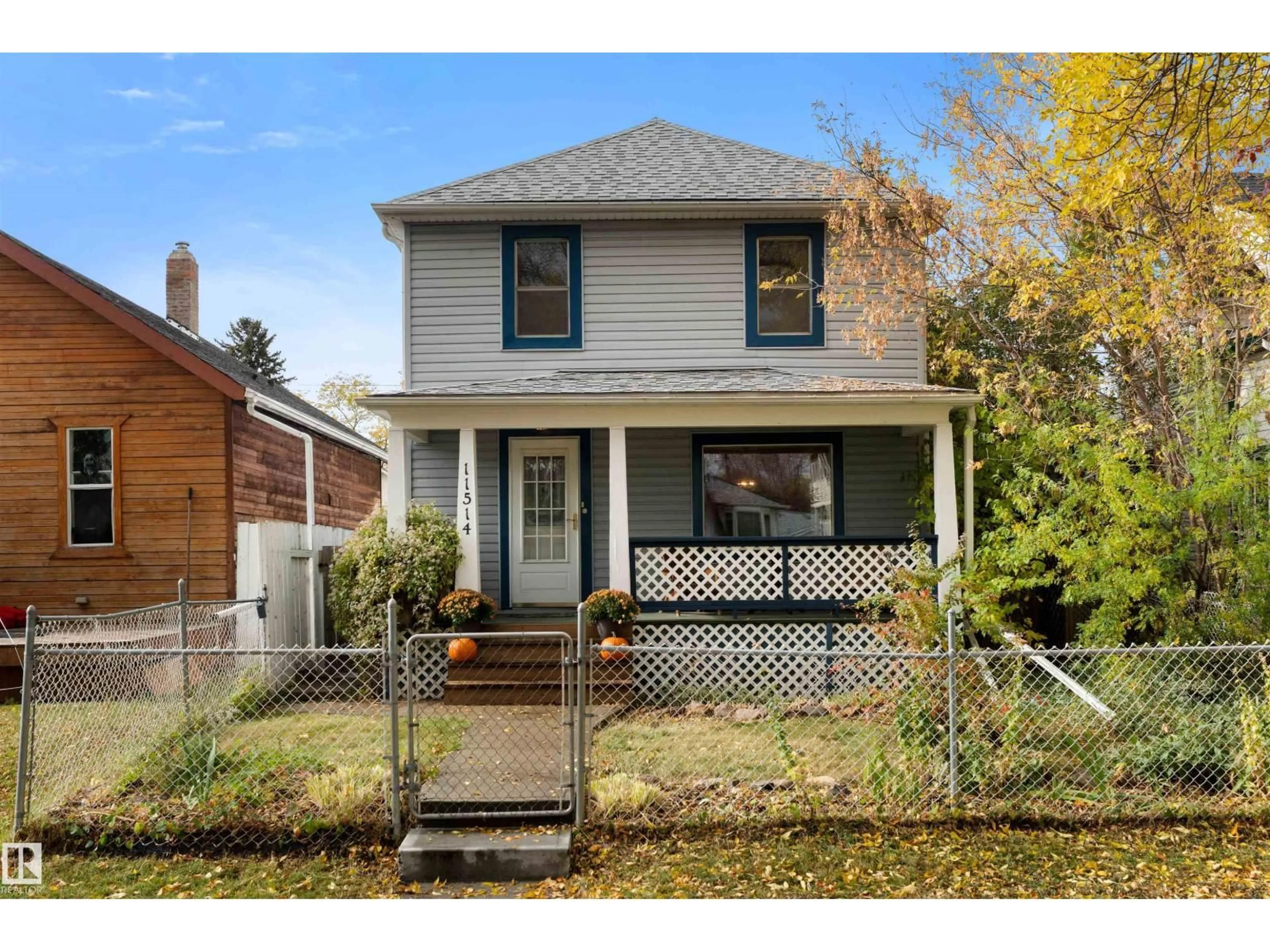 Home with vinyl exterior material, street for 11514 93 ST, Edmonton Alberta T5G1C7