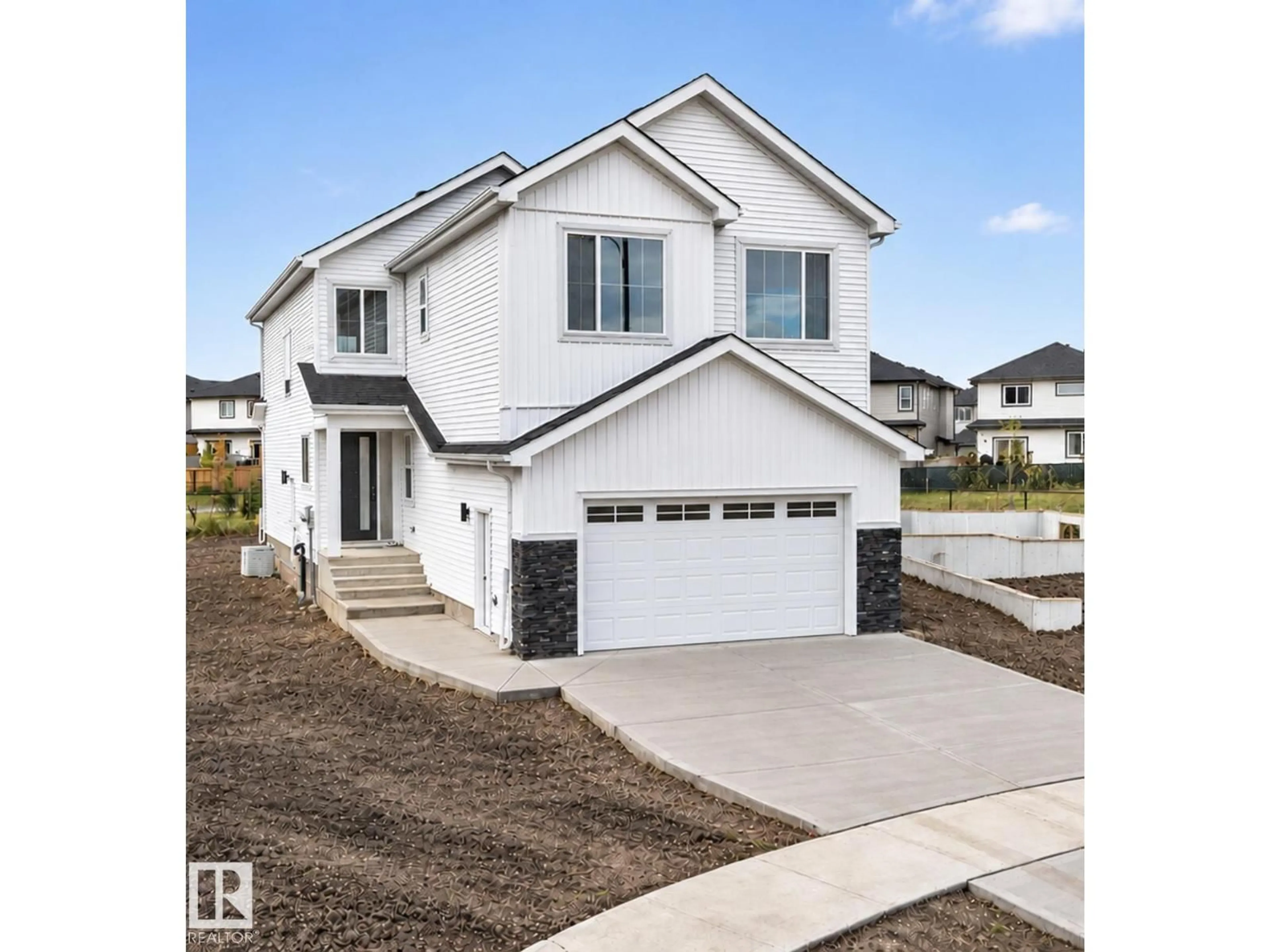 Home with vinyl exterior material, street for 318 ELLIOTT WD, Fort Saskatchewan Alberta T8L3X6