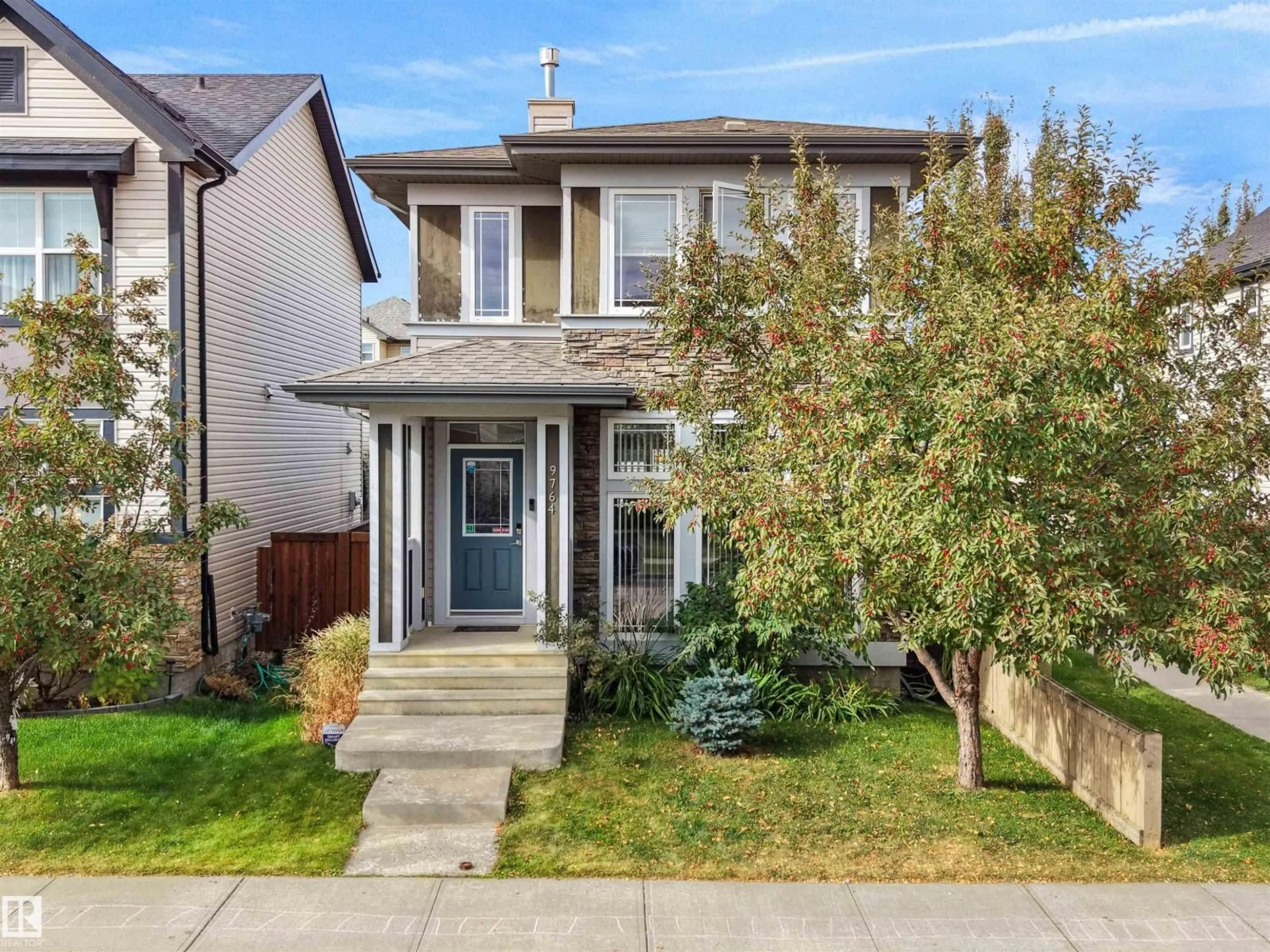 Home with vinyl exterior material, street for NW - 9764 221 ST, Edmonton Alberta T5T4M1