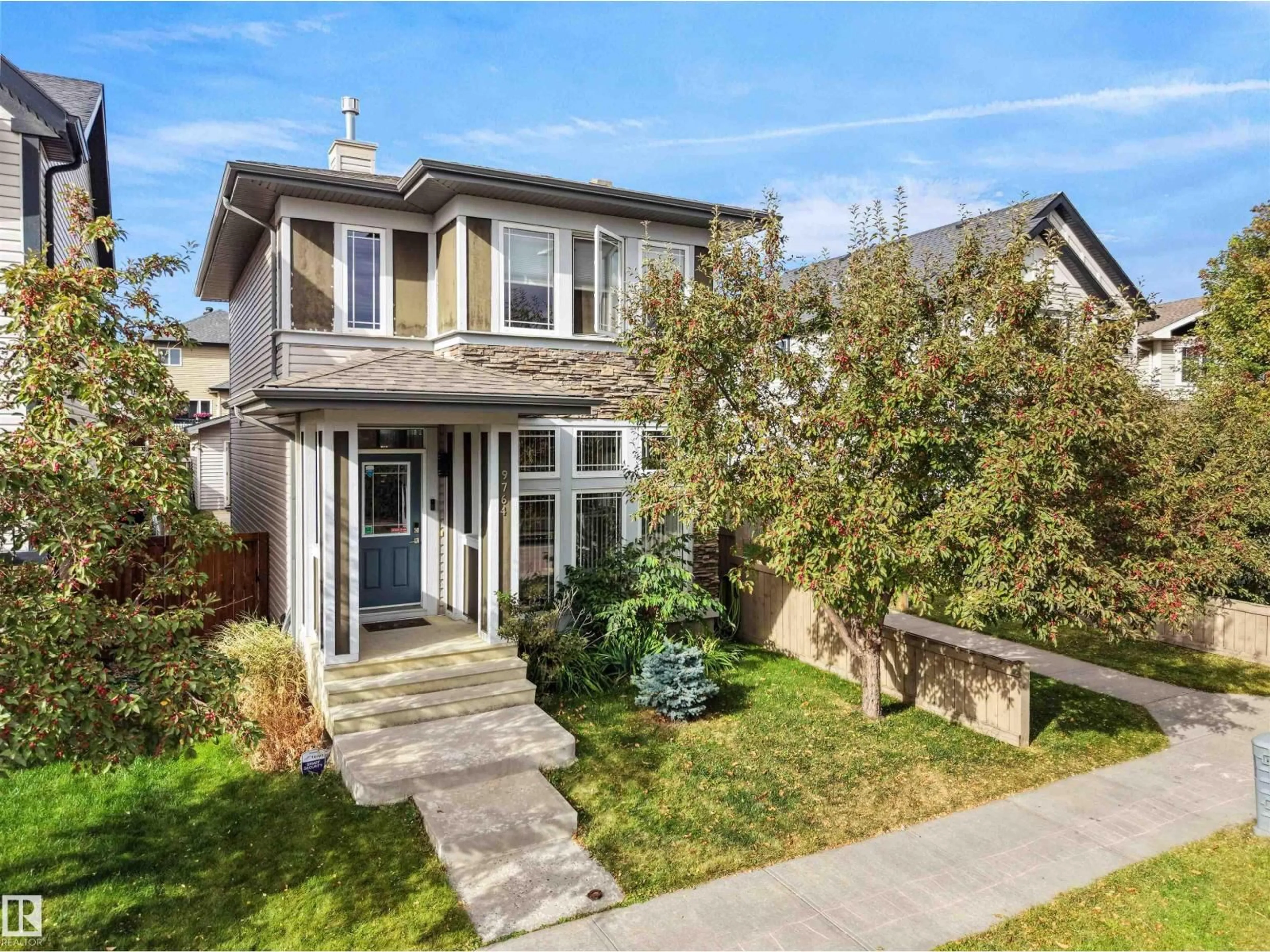 Home with brick exterior material, street for NW - 9764 221 ST, Edmonton Alberta T5T4M1