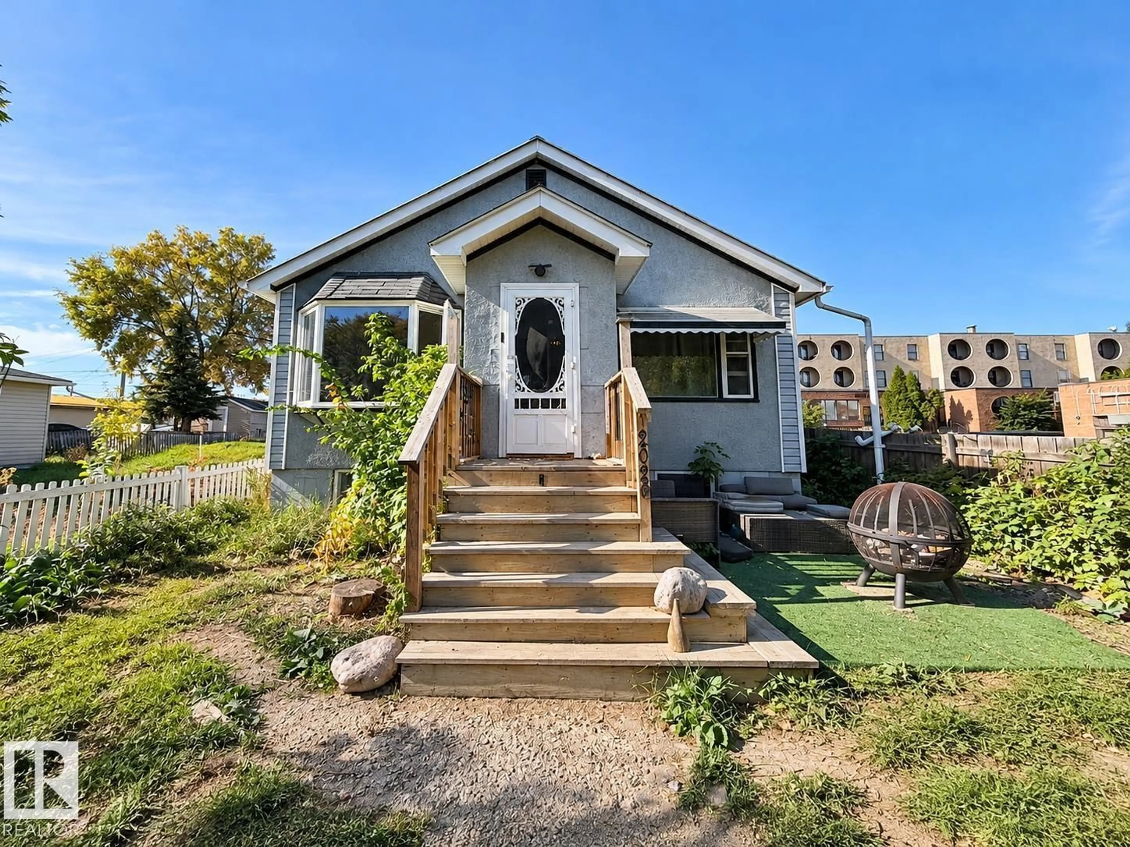 Home with vinyl exterior material, street for 12026 77 ST, Edmonton Alberta T5B2G7
