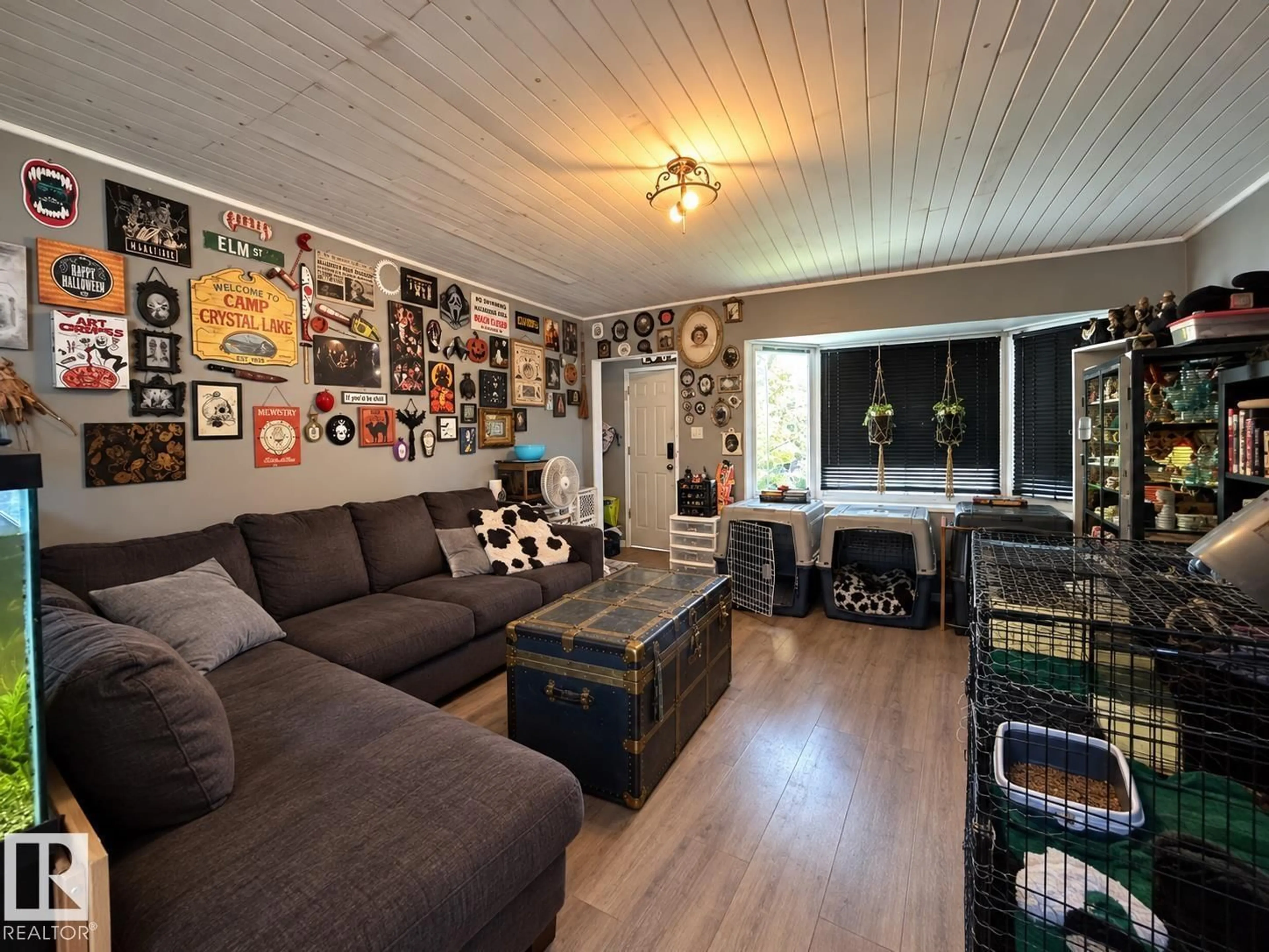 Living room with furniture, wood/laminate floor for 12026 77 ST, Edmonton Alberta T5B2G7