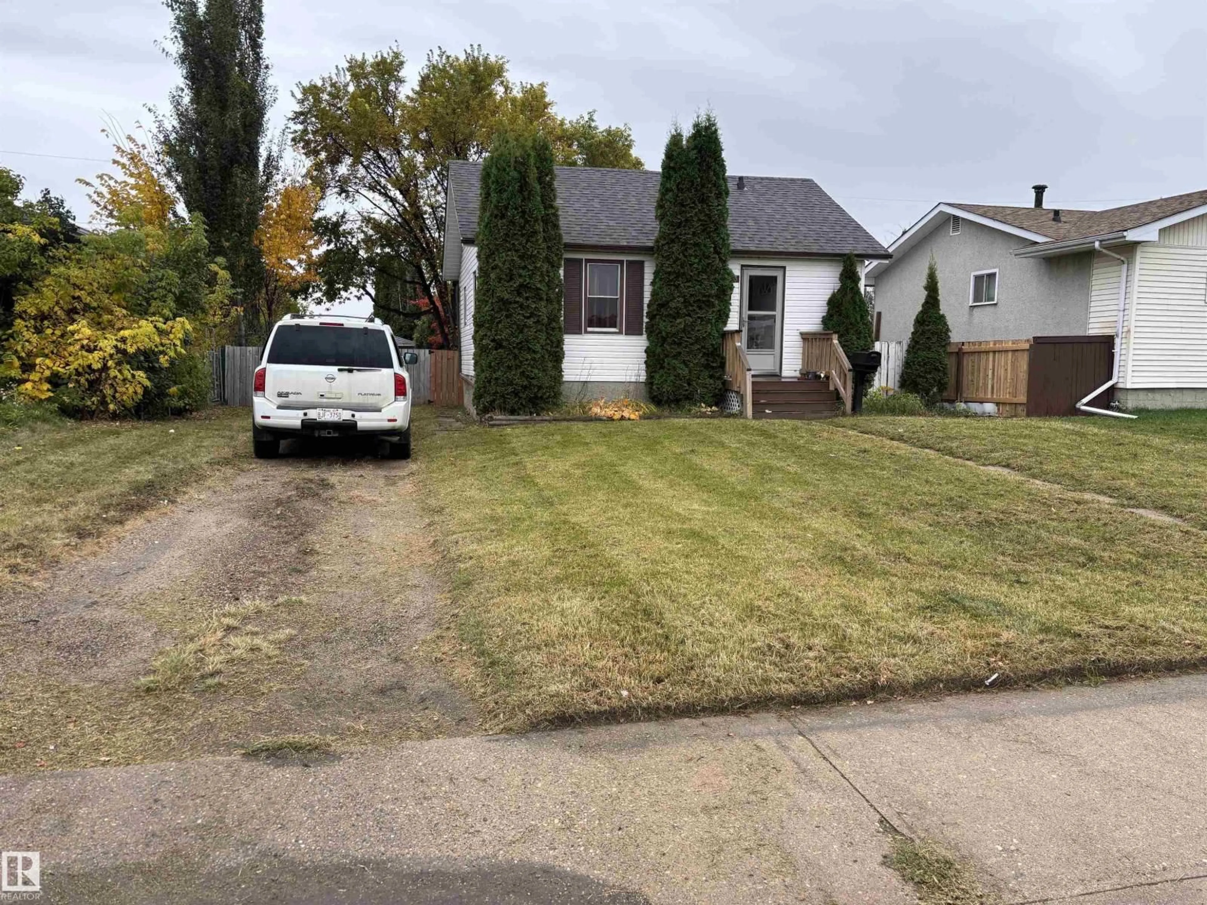 A pic from outside/outdoor area/front of a property/back of a property/a pic from drone, street for 7623 130 AV, Edmonton Alberta T5C1Y3