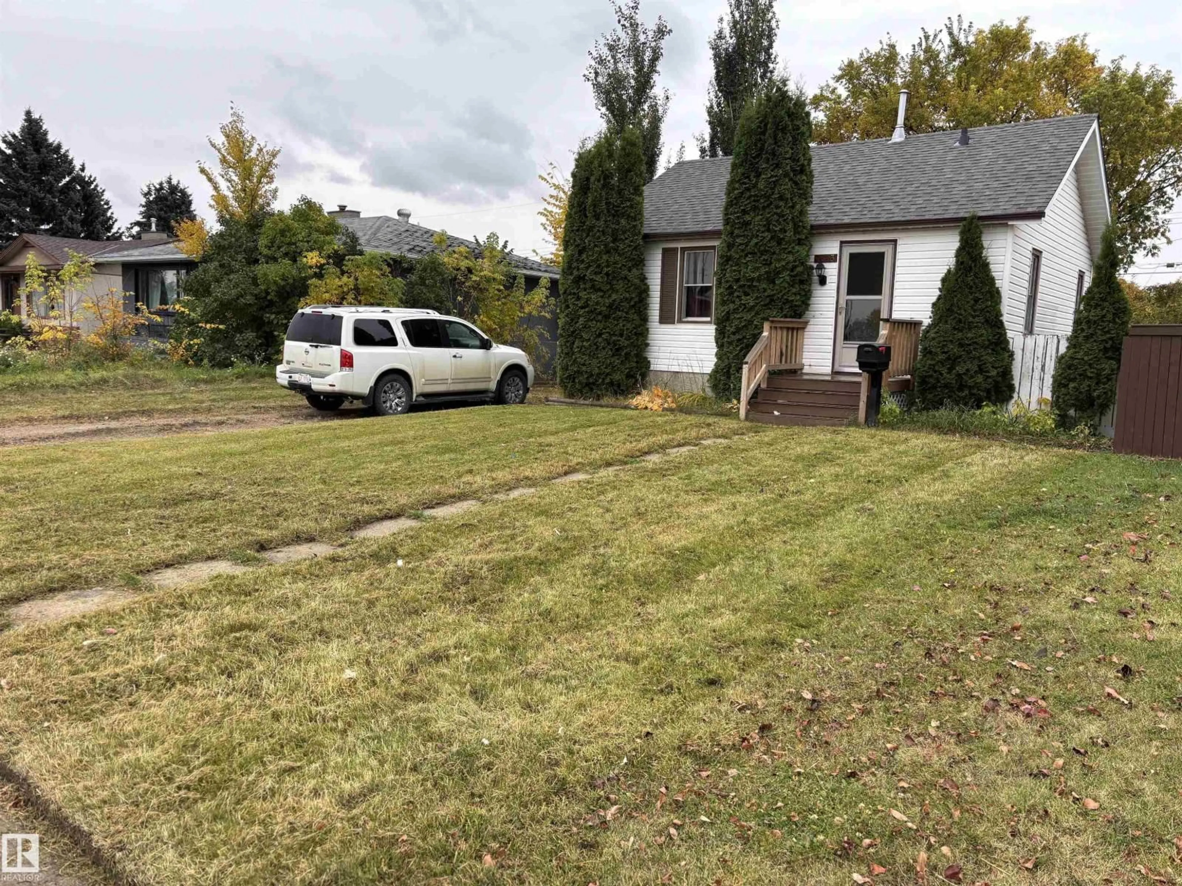 A pic from outside/outdoor area/front of a property/back of a property/a pic from drone, street for 7623 130 AV, Edmonton Alberta T5C1Y3