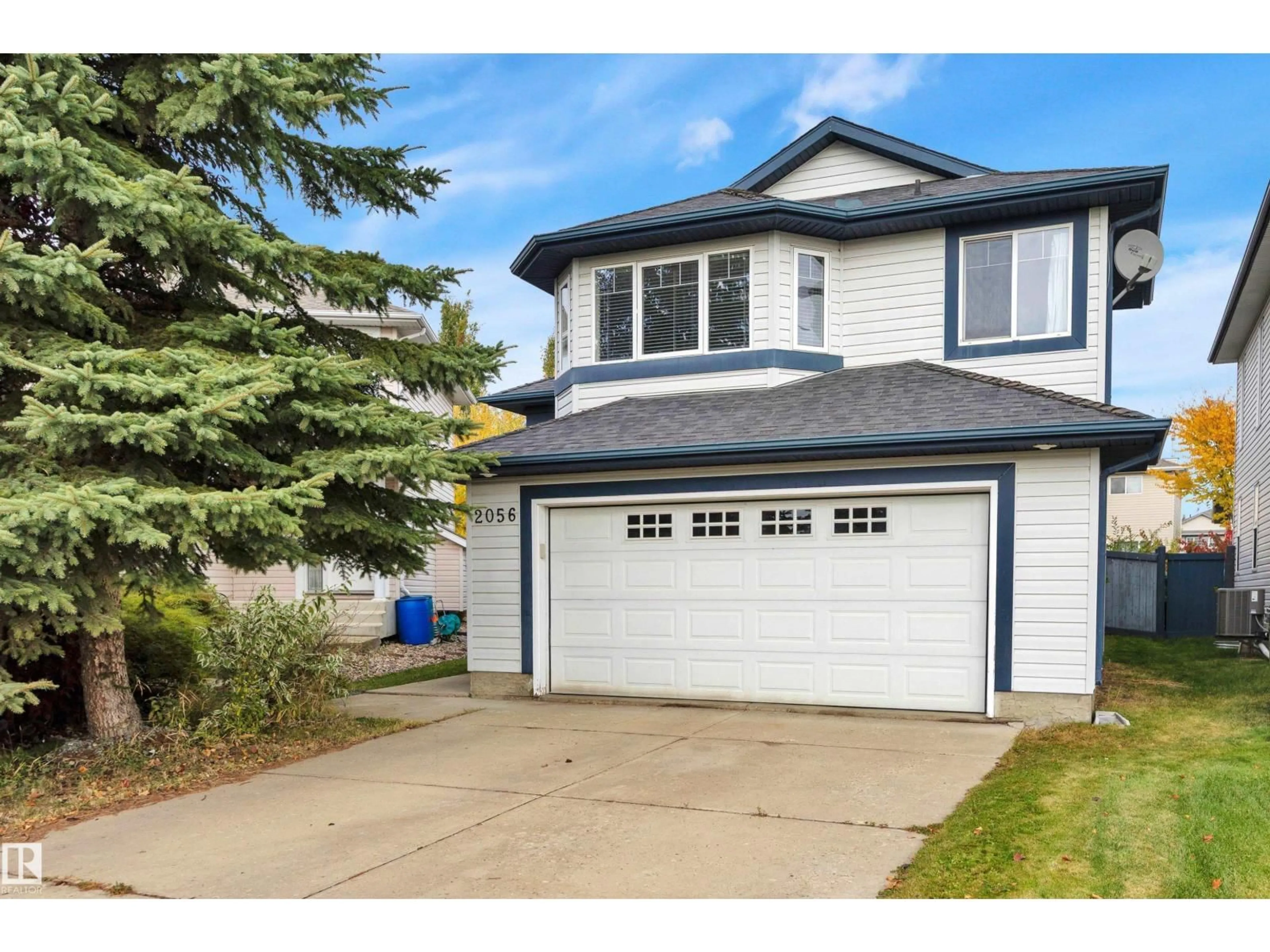 Home with vinyl exterior material, street for 2056 BLACKMUD CREEK DR, Edmonton Alberta T6W1E7