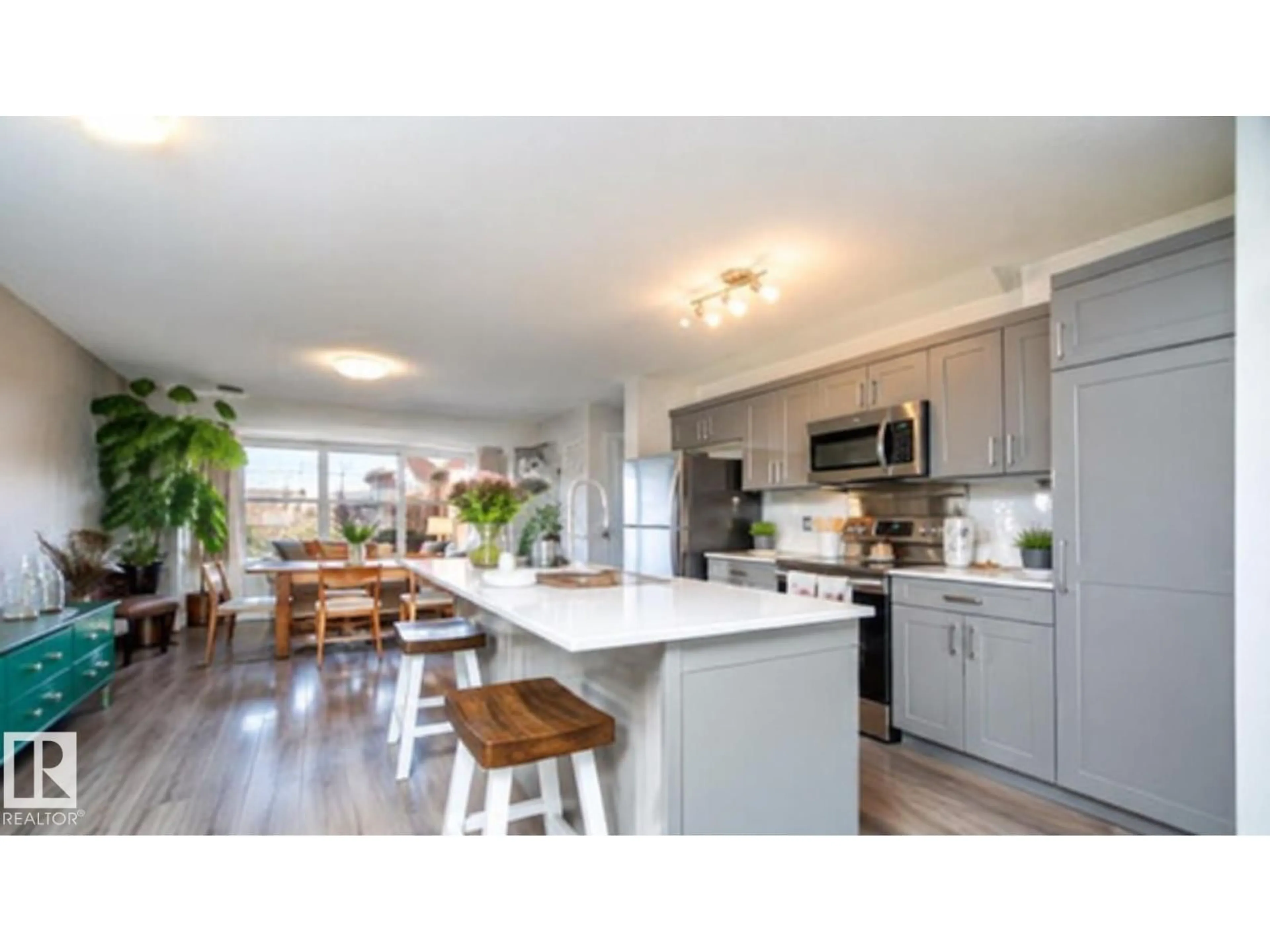 Open concept kitchen, wood/laminate floor for 3040 CHECKNITA WY, Edmonton Alberta T6W3X8