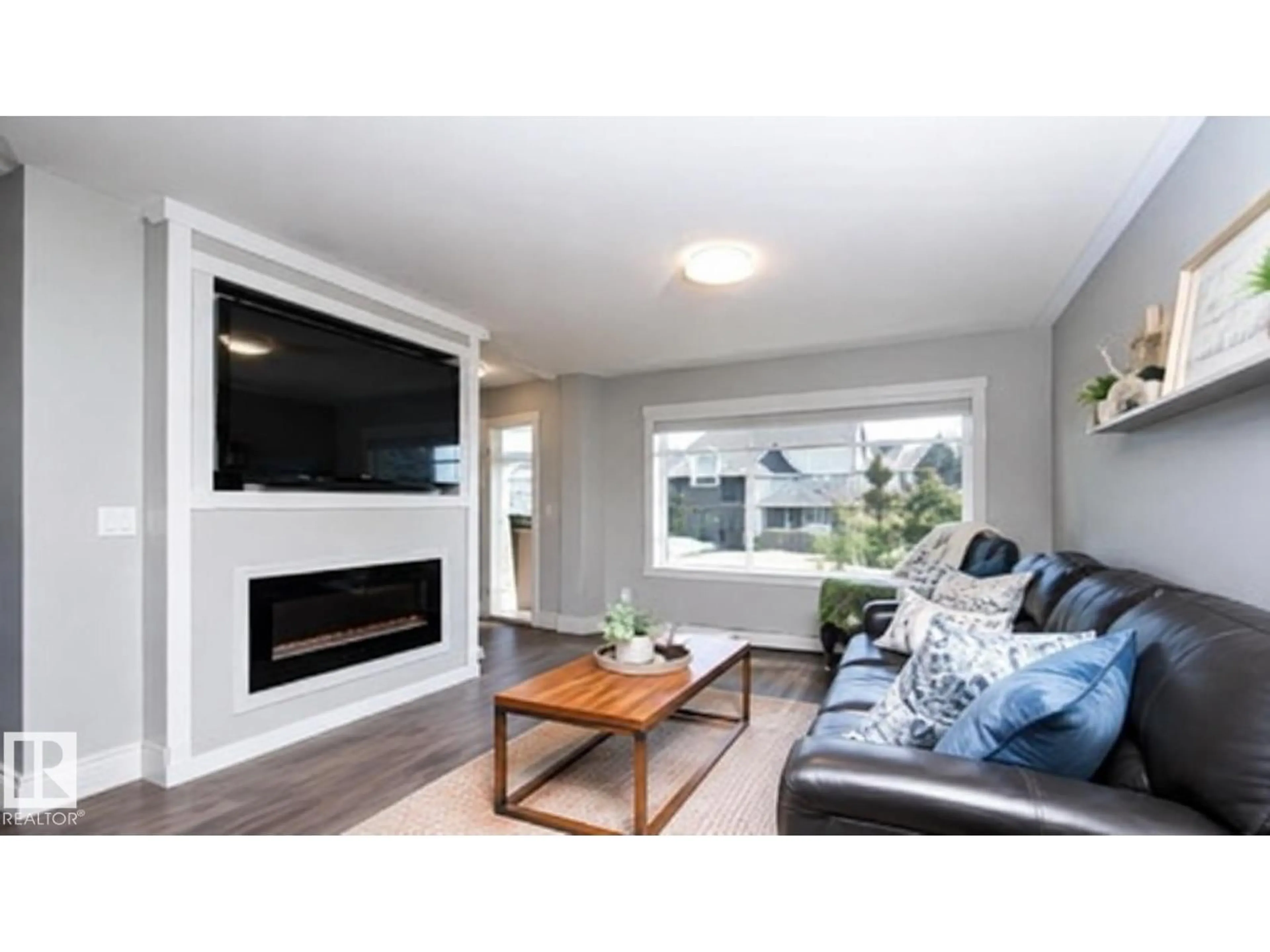 Living room with furniture, wood/laminate floor for 3040 CHECKNITA WY, Edmonton Alberta T6W3X8