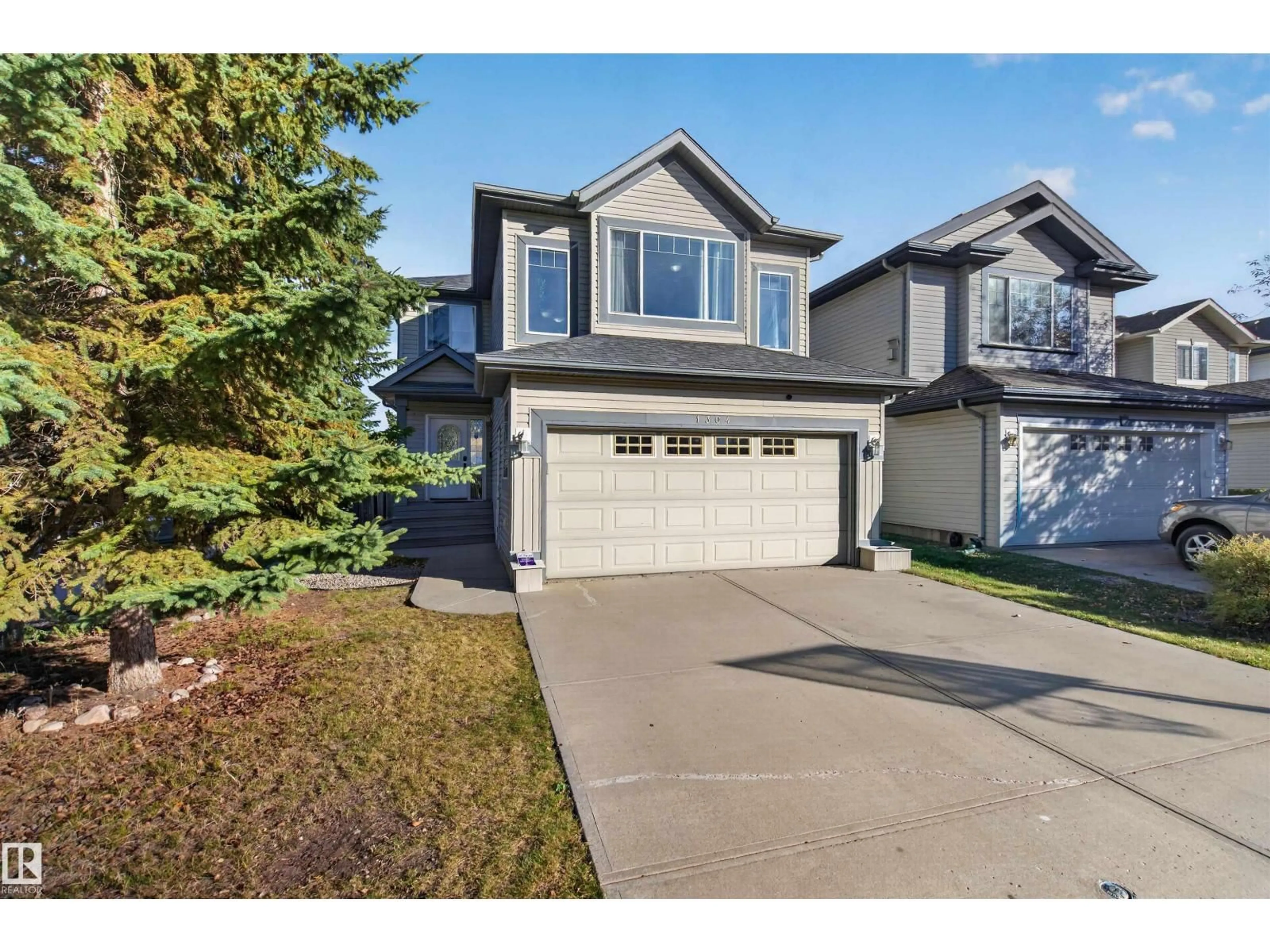 Home with vinyl exterior material, street for 1304 BARNES CL, Edmonton Alberta T6W1E5
