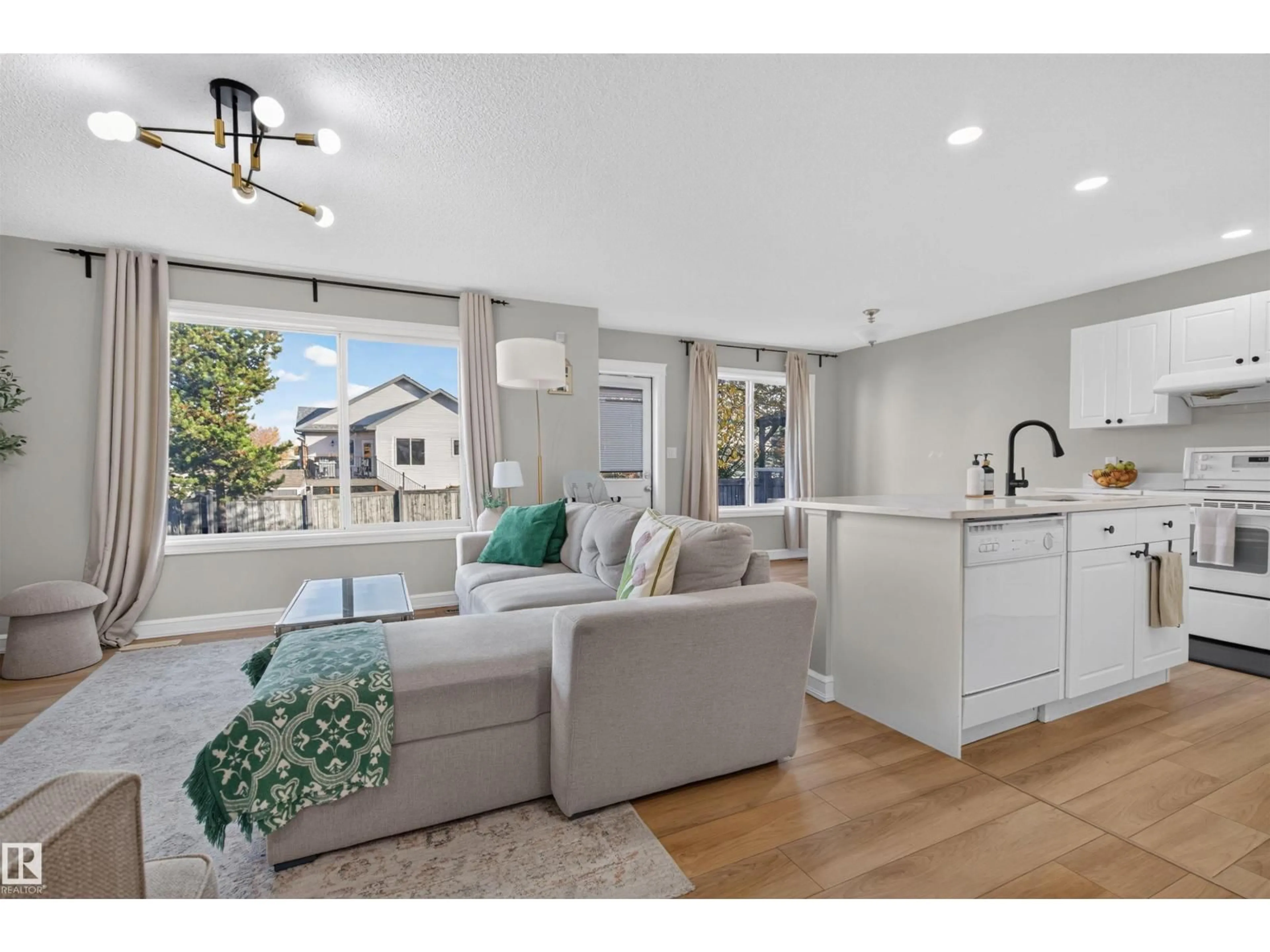 Open concept kitchen, wood/laminate floor for 1304 BARNES CL, Edmonton Alberta T6W1E5