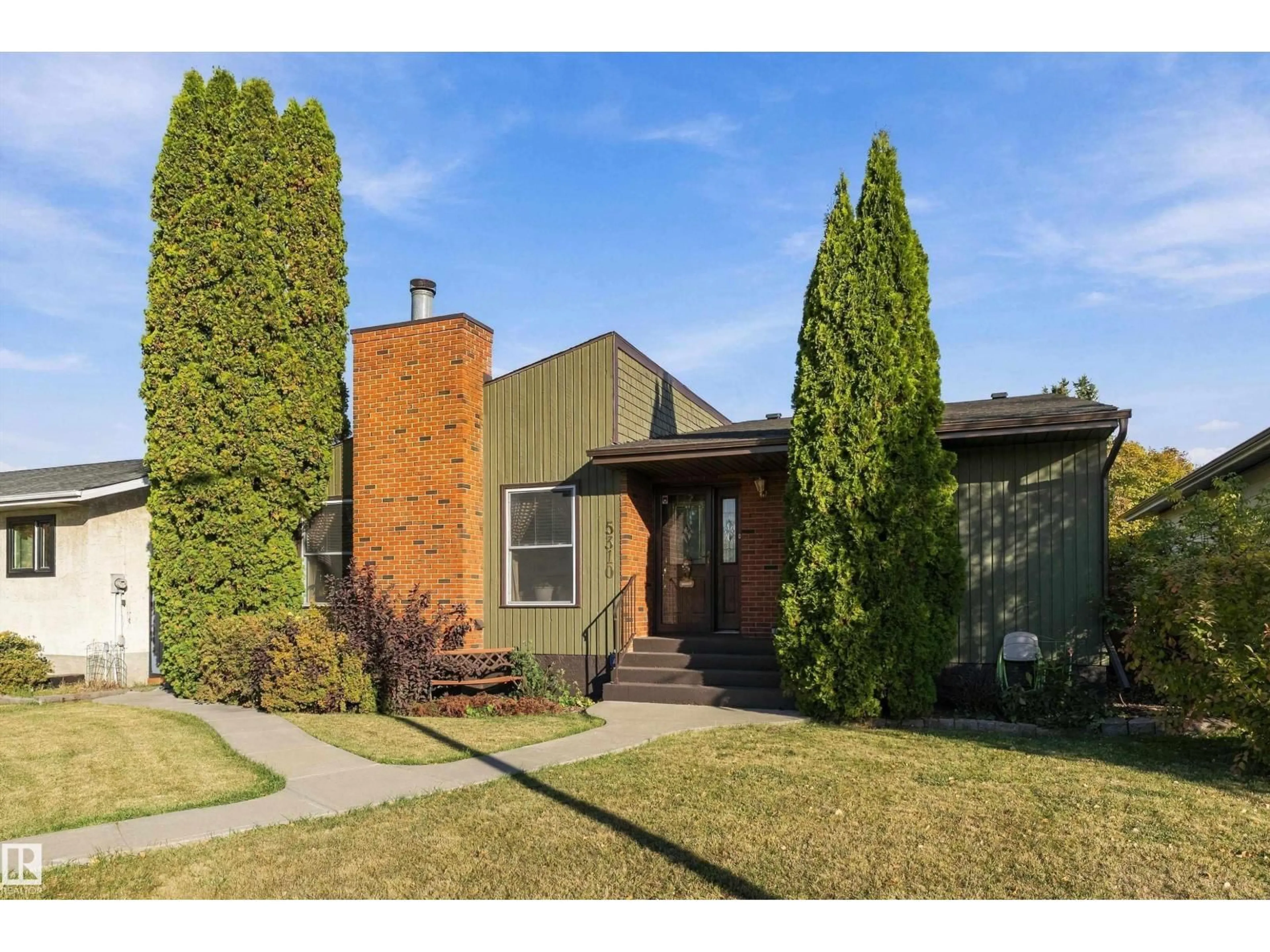 Home with brick exterior material, street for NW - 5310 18A AV, Edmonton Alberta T6L1J8