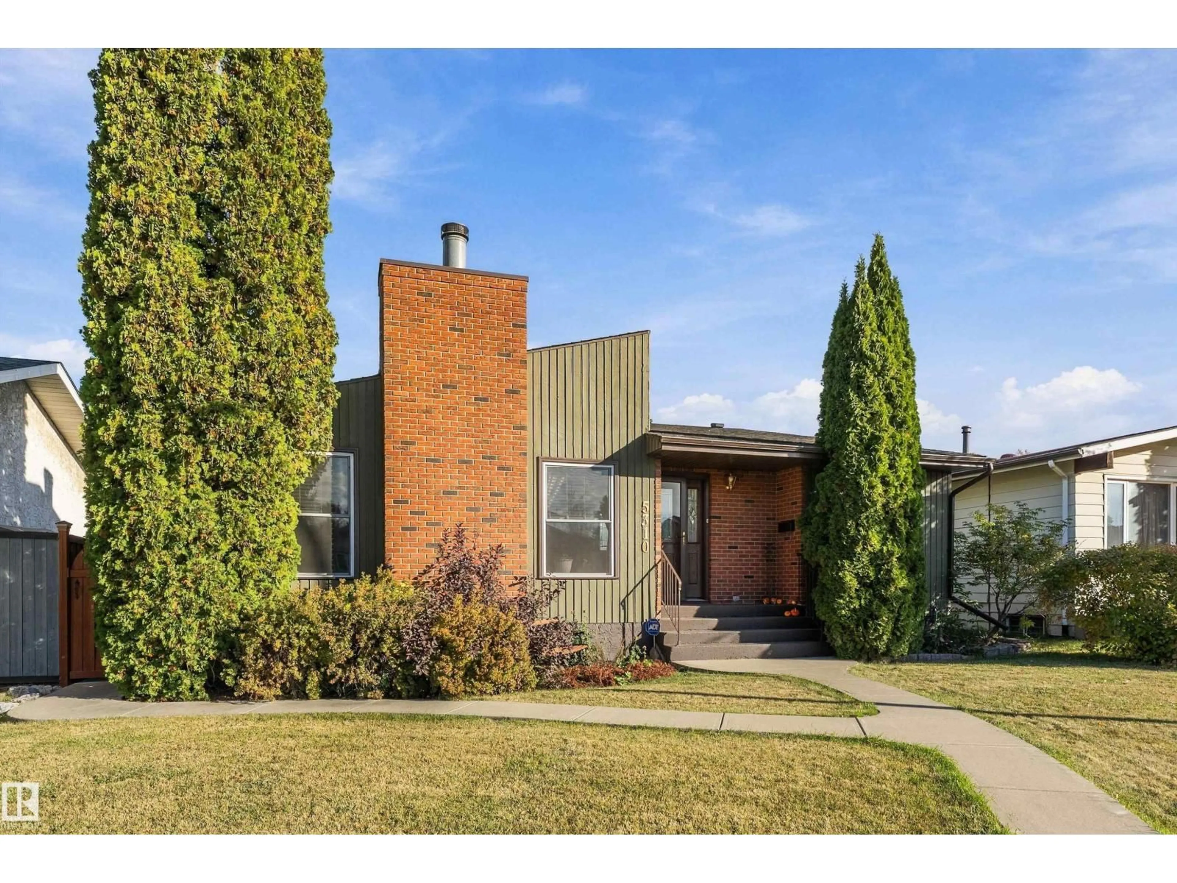 Home with brick exterior material, street for NW - 5310 18A AV, Edmonton Alberta T6L1J8